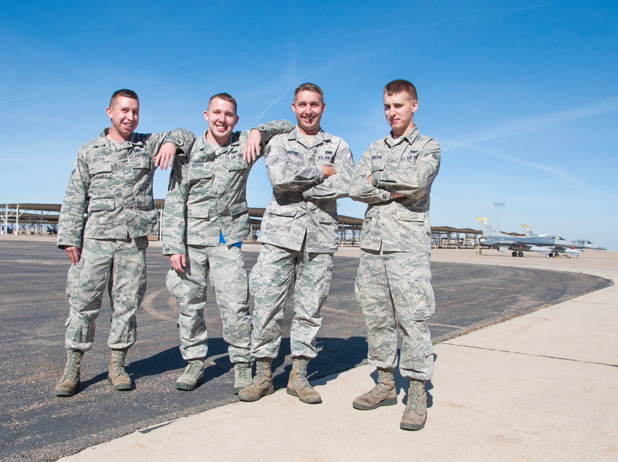 Airman 1st Class Timothy Potter, left, stands next to his three brothers Senior Airman David Potter, Staff Sgt. Andrew Potter, and Senior Airman Samuel Potter, all with the wing’s 67th Aerial Port Squadron.  Timothy serves alongside his four brothers in the 419th Fighter Wing. (U.S. Air Force photo/Senior Airman Crystal Charriere)
