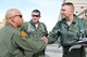 Col. Joe Martinez II (left), 150th Fighter Wing commander, greets Lt. Col. Ronald Hedges (middle) and Maj. Jim Hawkes, A-10 Thunderbolt II pilots Nov. 3 at Kirtland Air Force Base, N.M. More than 150 pilots, maintainers and support personnel from the 124th Fighter Wing, Idaho Air National Guard, traveled to Albuquerque for a weeklong training exercise. (U.S. Air Force photo by Tech. Sgt. Becky Vanshur)