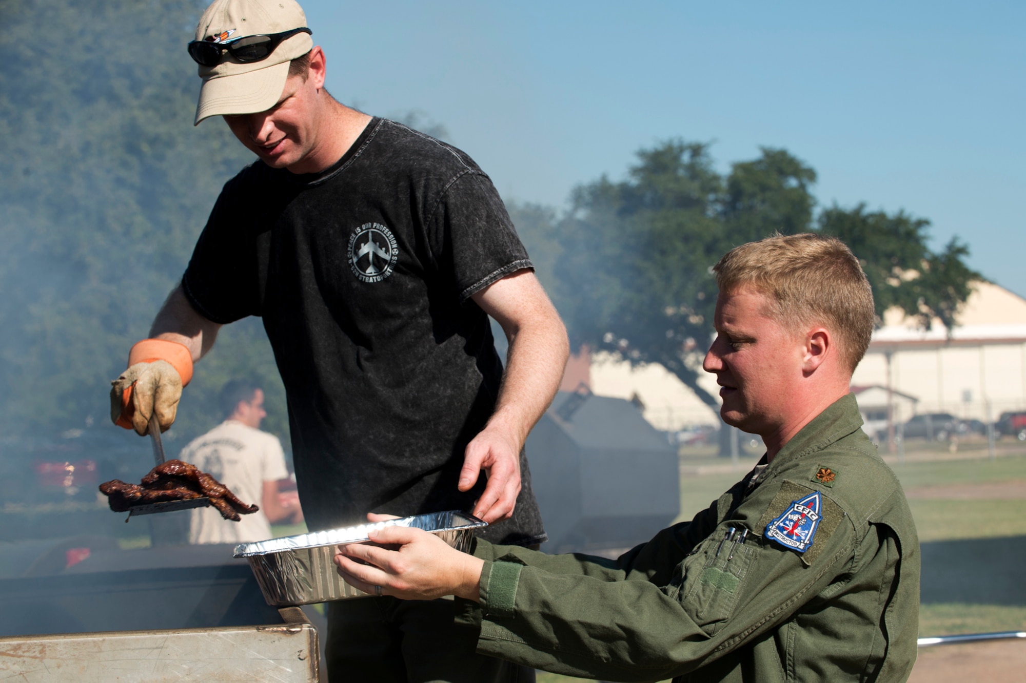U.S. Air Force Maj’s Kevin Smith and Rome Kennedy cook steaks for a lunch honoring maintenance personnel assigned to the 307th Aircraft Maintenance Squadron, Nov. 2, 2012, Barksdale Air Force Base, La. The 93rd and 11th Bomb Squadrons, who fly the B-52H Stratofortress, recognized the maintainers for their outstanding maintenance in keeping a 93 percent Mission Capable Rate on the 50+ year old aircraft. (U.S. Air Force photo by Master Sgt. Greg Steele/Released)