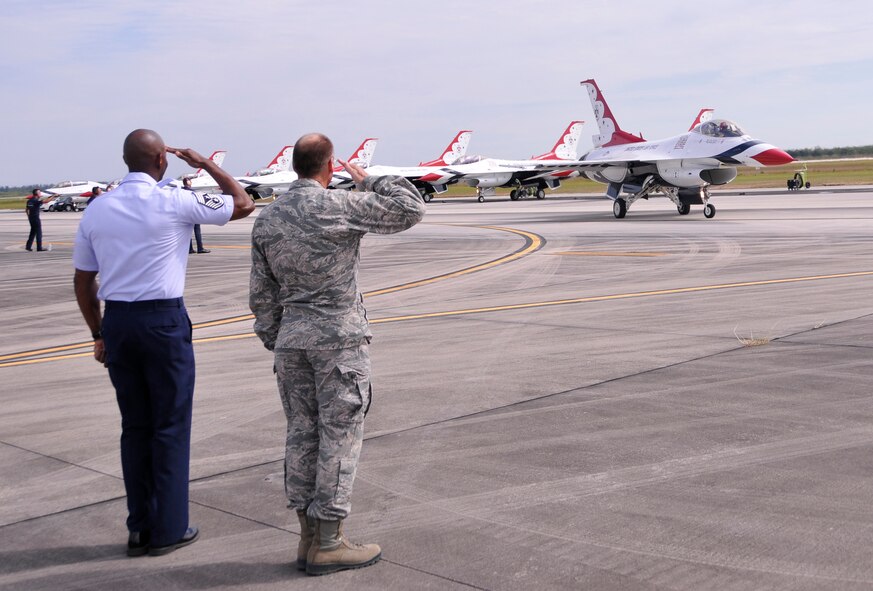 Col. Donald R. Lindberg, 482nd Fighter Wing commander (right), and Chief Master Sgt. Cameron Kirksey, 482nd FW command chief master sergeant, salute the U.S. Air Force Thunderbirds as they depart Homestead Air Reserve Base, Fla., after the Wings Over Homestead air show, Nov. 5. (U.S. Air Force photo/Senior Airman Jacob Jimenez)