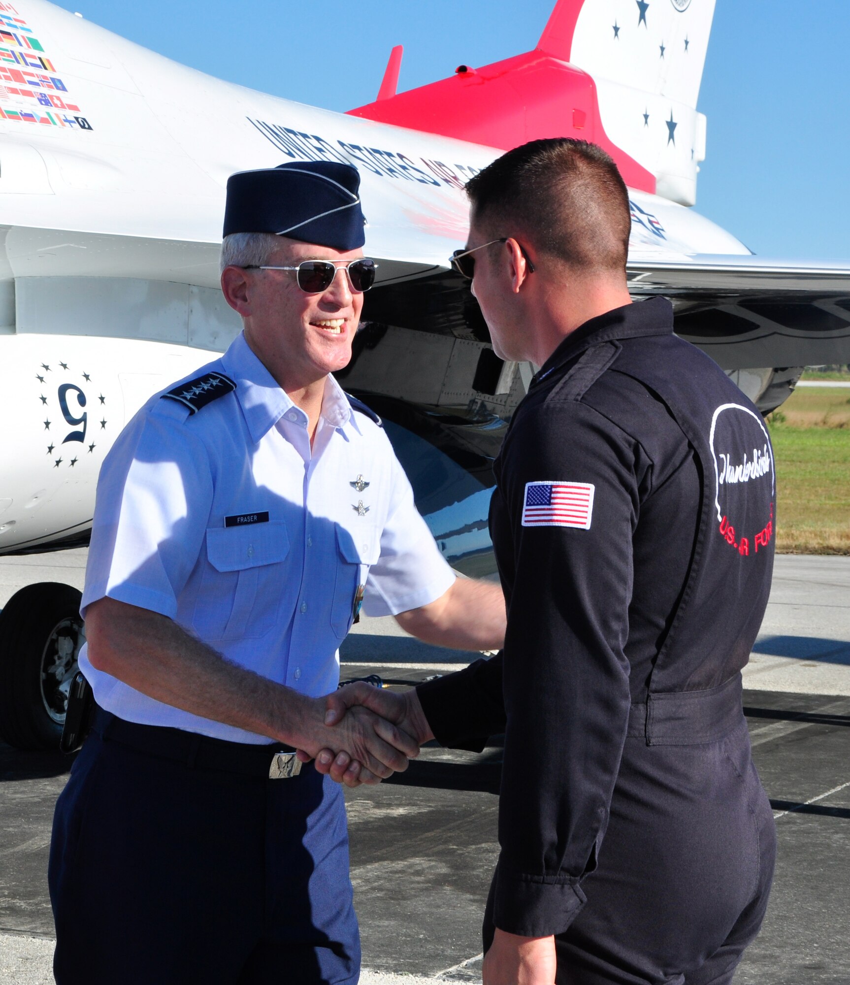 Gen. Douglas M. Fraser, U.S. Southern Command commander, greets the U.S. Air Force Thunderbirds during the Wings Over Homestead air show at Homestead Air Reserve Base, Fla., Nov. 3. (U.S. Air Force photo/Tech. Sgt. Robert Gibson)