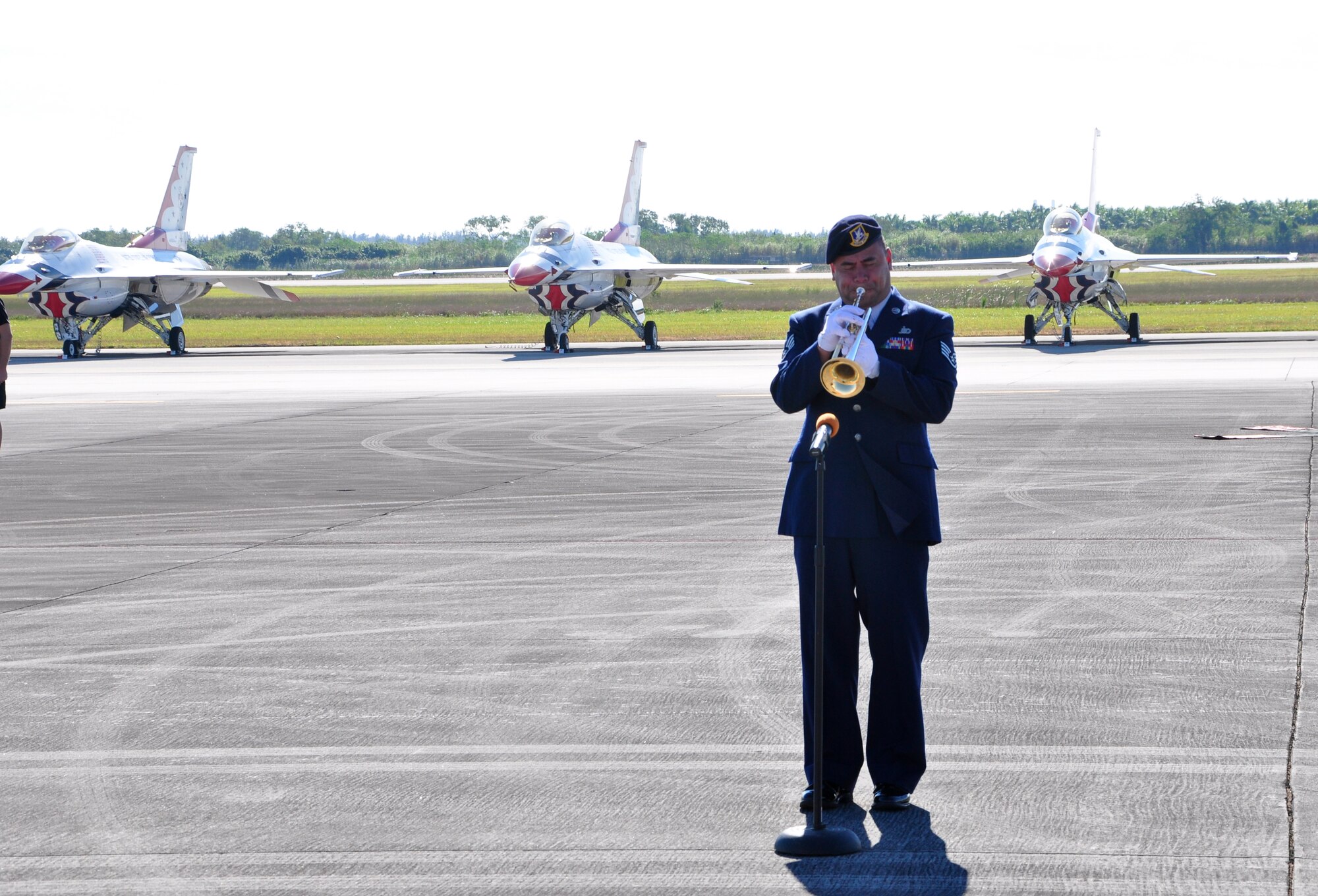 Staff Sgt. Johnny Holiday, 482nd Security Forces Squadron, plays the National Anthem during the Wings Over Homestead air show at Homestead Air Reserve Base, Fla., Nov. 3. (U.S. Air Force photo/Tech. Sgt. Robert Gibson)