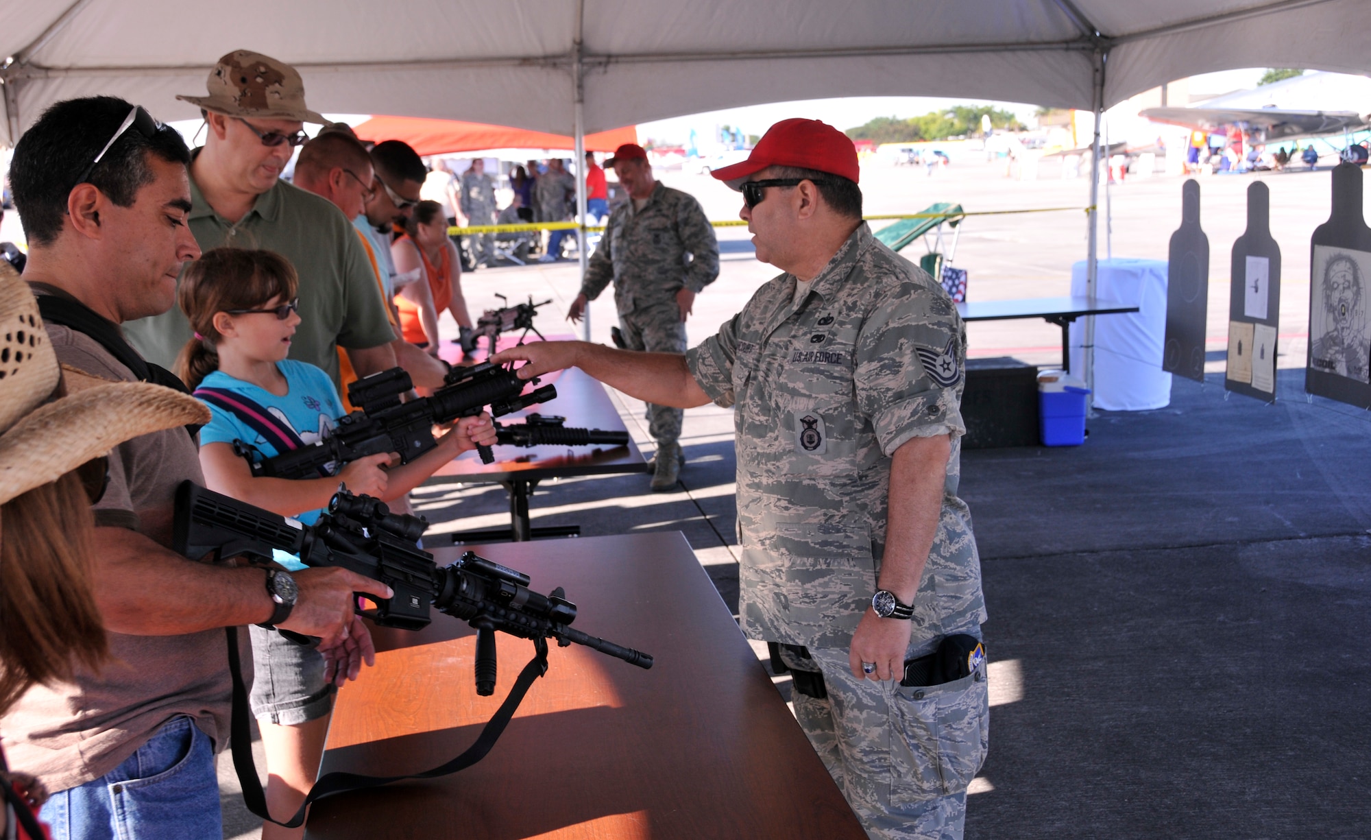 Spectators check out the Combat Arms Training and Maintenance tent during the Wings Over Homestead air show at Homestead Air Reserve Base, Fla., Nov. 3. (U.S. Air Force photo/Staff Sgt. Lou Burton)