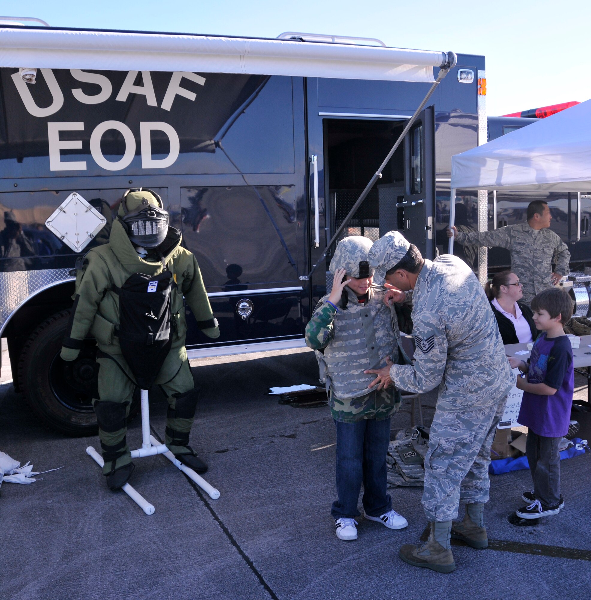 Children don gear from the 482nd Civil Engineering Squadron Explosive Ordnance Disposal unit during the Wings Over Homestead air show at Homestead Air Reserve Base, Fla., Nov. 3. (U.S. Air Force photo/Staff Sgt. Lou Burton) 
