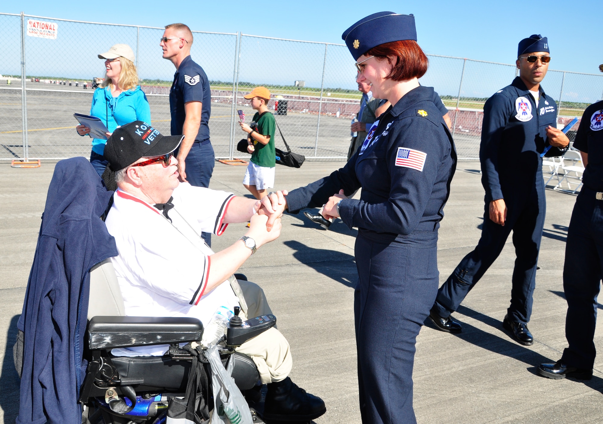 Maj. Kristin Haley, U.S. Air Force Thunderbirds public affairs officer, greets a Wounded Warrior during the Wings Over Homestead air show Wounded Warriors meet and greet at Homestead Air Reserve Base, Fla., Nov. 2. (U.S. Air Force photo/Tech. Sgt. Robert Gibson) 
