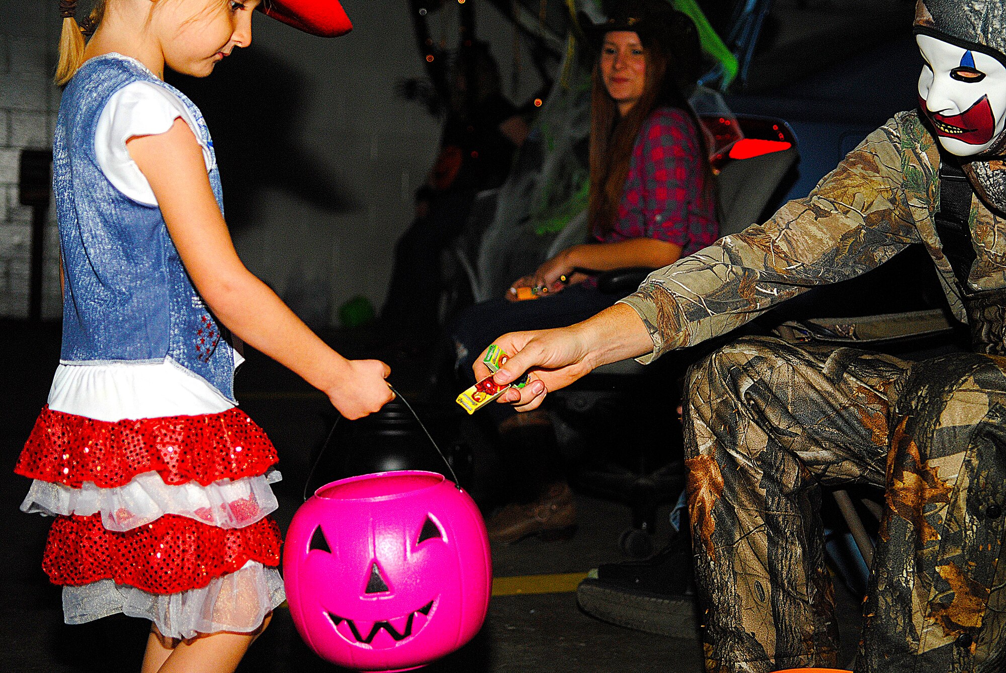 MINOT AIR FORCE BASE, N.D. -- Children and their parents had the opportunity to enjoy a warm and comfortable Halloween at the 5th Logistics Readiness Squadron's ‘Trunk-or-Treat’ event here, Oct. 31.The Airmen who handed out candy at the event decorated their vehicles with a diverse range of Halloween-type ornamentations. Many of them dressed in their own unique Halloween getups.  (U.S. Air Force photo/2nd Lt. Jose R. Davis) 