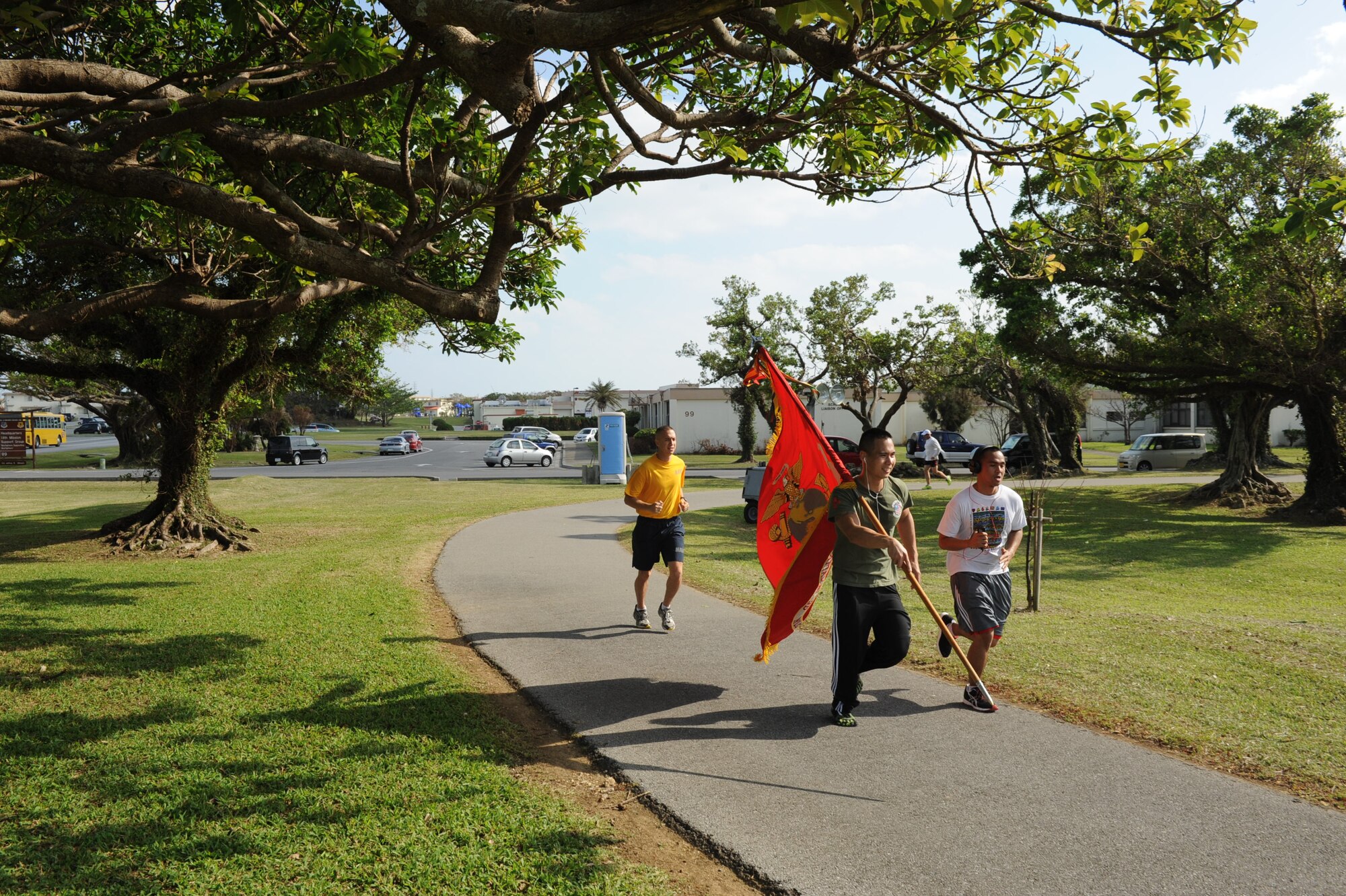 Runners from all branches of service participate in a Kadena Special Olympics 24-hour run on Kadena Air Base, Nov. 7, 2012. The KSO began in 2000 with approximately 400 athletes and 600 volunteers as an 18th Wing community goodwill initiative to strengthen U.S. - Okinawa relationships. (U.S. Air Force Airman 1st Class Brooke P. Beers)