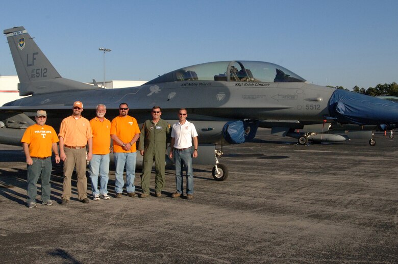 (Left to right) William James, Chip Hall, Jim Robinson, David Robinson, Lt. Col. Joe DeLapp, and Lt. Col. James A. DeLapp pose by an F-16 Falcon fighter jet at the Knoxville, Tenn., airport Nov. 3, 2012. The group had just attended the Tennessee Volunteers game against the Troy Trojans at Neyland Stadium. Joe DeLapp participated in the game's flyover and his brother  DeLapp is the commander of the U.S. Army Corps of Engineers Nashville District and attended to pay tribute to former district engineer and Vols legendary coach General Robert R. Neyland.  It has been 60 years since Neyland's coaching career ended. (USACE photo by Leon Roberts)