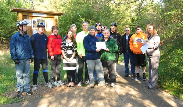 Old Hickory Lake Resource Manager Crystal Tingle presents volunteers that contributed to the construction and completion of the Shutes Branch Mountain Bike Trail a certificate of appreciation during the Shutes Branch Mountain Bike Trail’s Grand Opening on Saturday, Nov. 3, 2012, Old Hickory Lake (USACE photo by Amy Redmond)