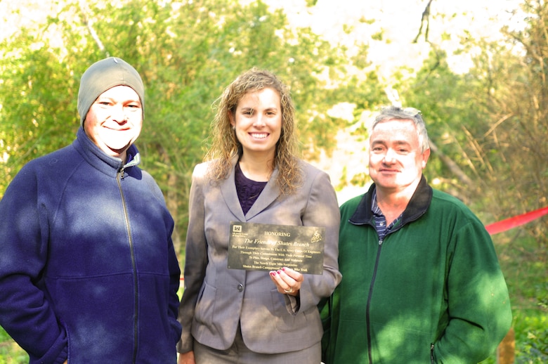 Old Hickory Lake Resource Manager Crystal Tingle honors the Friends of Shutes Branch, a mountain biking interest group, responsible for the planning, design, construction, and maintenance of the 7.9 mile Shutes Branch Mountain Bike Trail with a commemorative plaque that will be displayed on a bench located at the trailhead.   Steve Capps and Tommy Hatcher, members of the friend’s group, receive the honor at the grand opening celebration on Saturday, Nov. 3, 2012, Old Hickory Lake (USACE photo by Amy Redmond)