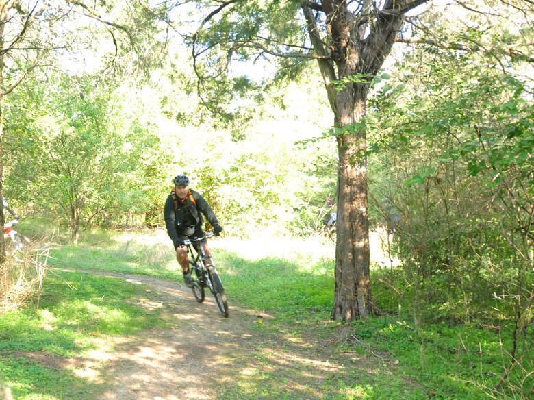A cyclist rounds a corner on the officially opened Shutes Branch Mountain Bike Trail after the grand opening celebration on Saturday, Nov. 3, 2012 at Old Hickory Lake (USACE photo by Amy Redmond)