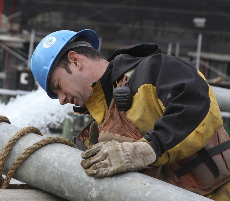 NEW YORK -- A contractor hooks up an outflow line from a second pump dewatering the Hugh Carey Tunnel also known as the Brooklyn Battery Tunnel. The Corps is has been tasked by FEMA to dewater the impacted infrastructure in the City (U.S. Army photo/Patrick Bloodgood)