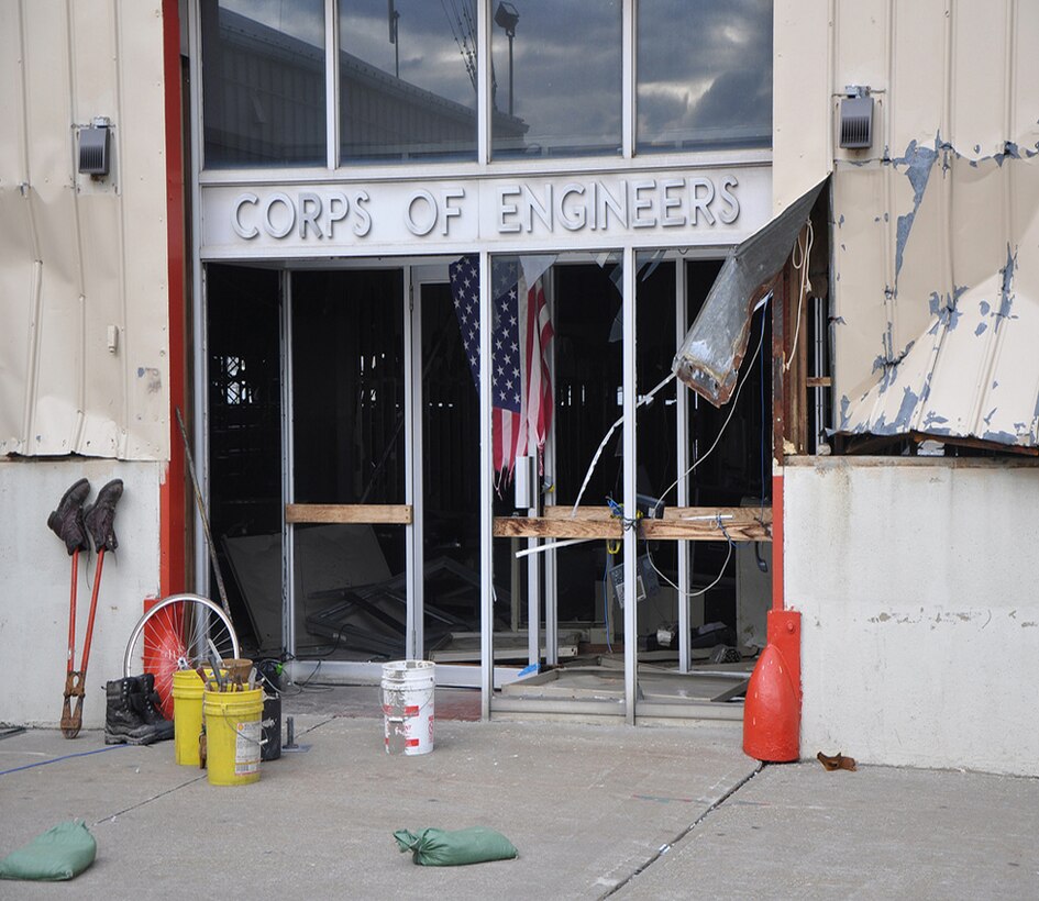 New York District's Caven Point Marine Terminal suffered extensive damages during Hurricane Sandy, as seen here just by the entrance. Despite the destruction of the main facility, New York District personnel have continued to support missions to support safe navigation of the New York and New Jersey Harbor, including working with the U.S. Coast Guard to conduct hydrographic surveys to map the safest routes for shipping and other vessels and through drift collection vessels working to clear tons of drift and debris from Hurricane Sandy that could be hazardous to navigation.