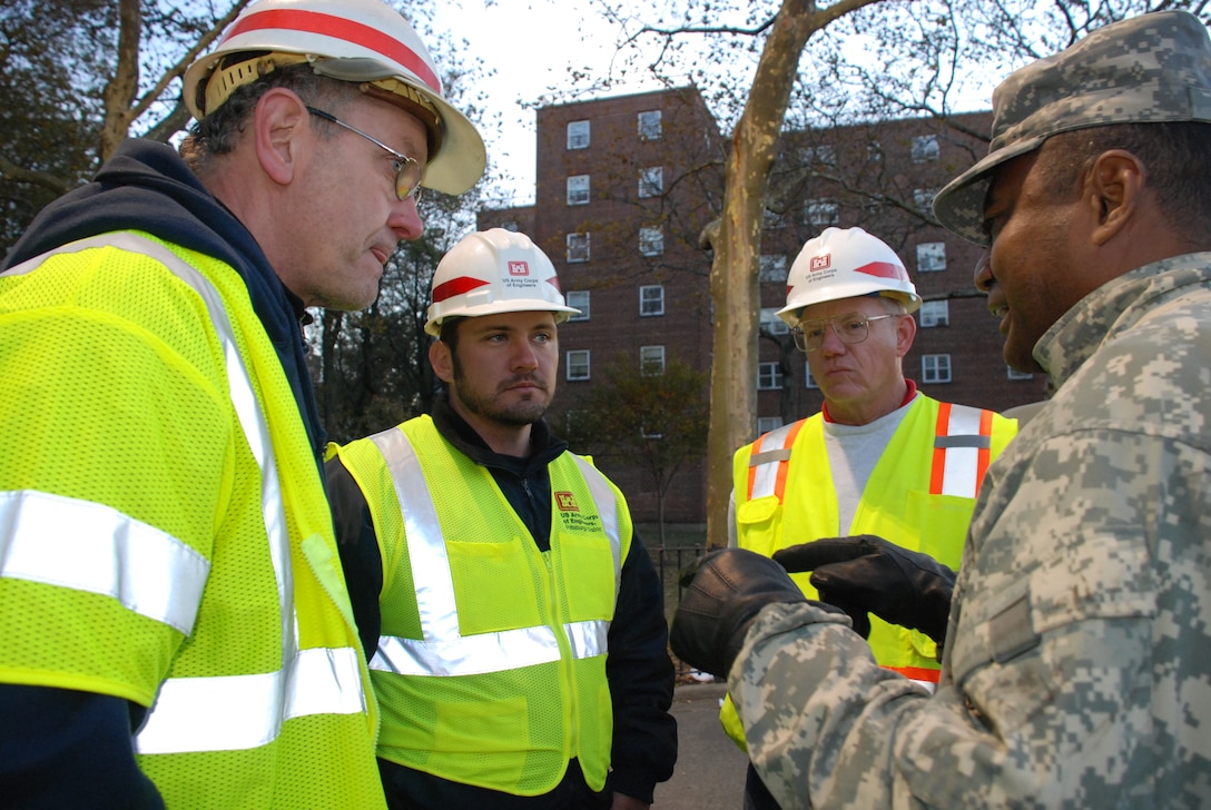 To date, the U.S. Army Corps of Engineers (USACE) has more than 38 FEMA Mission Assignments exceeding $134 million. Providing temporary emergency power to the nine buildings at the Redfern Housing Complex,in Far Rockaway, N.Y., as well as roughly 50 other buildings in six complexes throughout Far Rockaway, is one of those mission assignments. Some of the buildings, like four of the nine in the Redfern complex, must have water pumped out of the basements before power can be restored. 