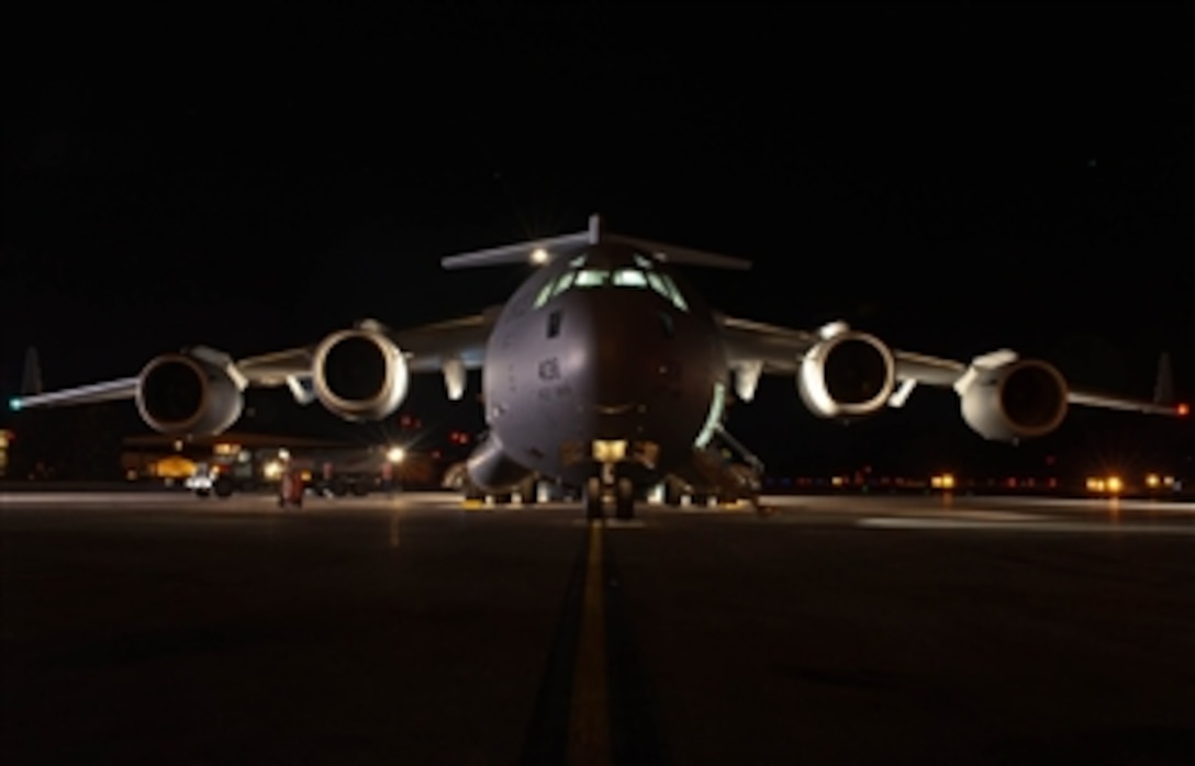 A U.S. Air Force C-17 Globemaster III is readied for loading on the tarmac at Ellsworth Air Force Base, S.D., on Nov. 2, 2012.  The Globemaster crew of reservists and technicians from March Air Reserve Base, Calif., are at Ellsworth to refuel, pick up supplies, equipment, and personnel to assist with the Hurricane Sandy relief effort.  