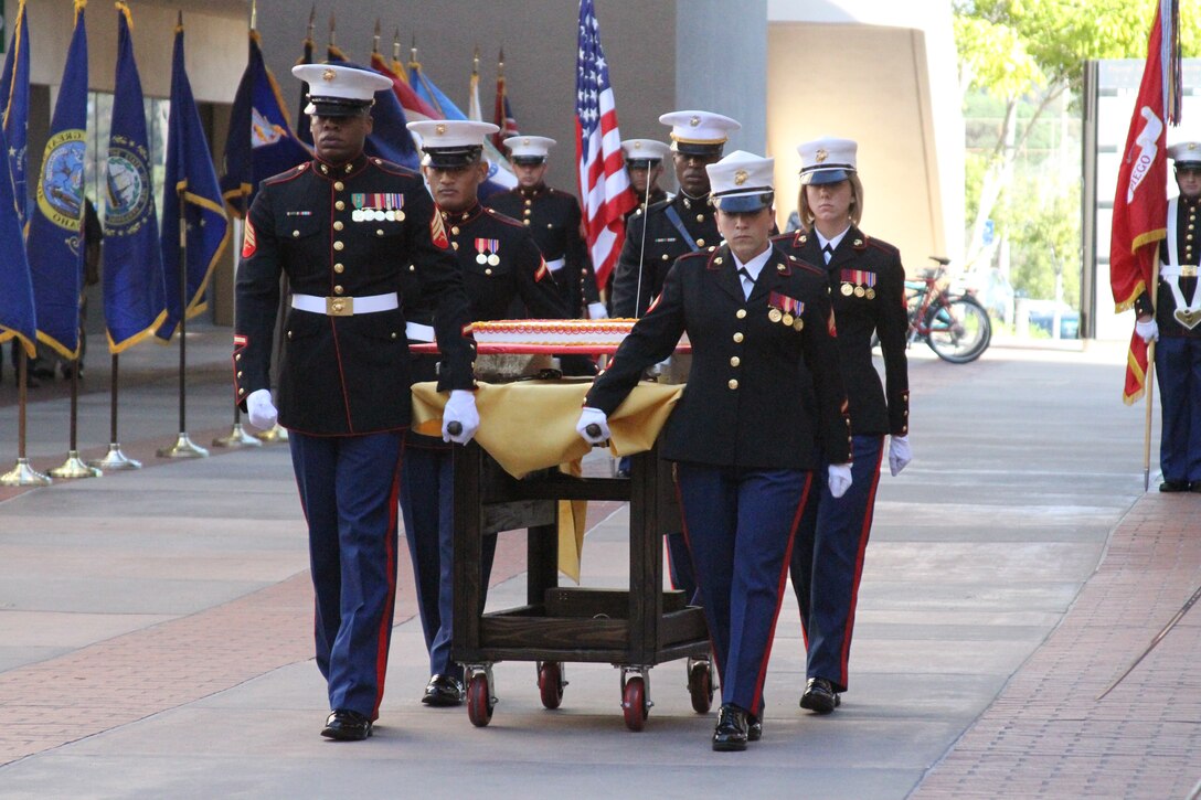 Marines of Marine Corps Recruit Depot San Diego escort the Marine Corps birthday cake at Naval Medical Center San Diego with the Wounded Warriors Nov. 5. The Marine Corps is celebrating it's 237th birthday.