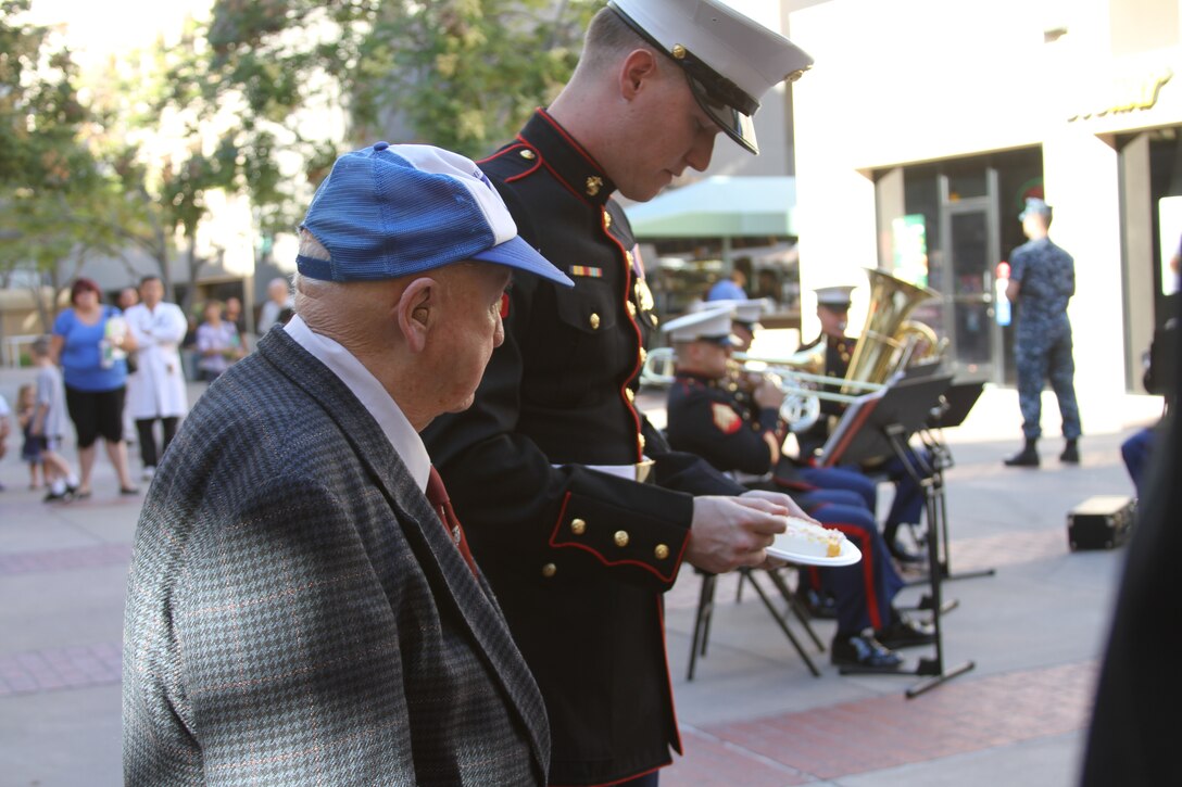 The passing of the cake from the oldest Marine to the youngest Marine symbolizes the passing of tradition, knowledge and history to the next generation. The oldest Marine present at the ceremony was Robert W. Samuel, born Oct. of 1923 in Pacific Beach, Calif., serving from 1942 to 1962. The youngest Marine present, Lance Cpl. Neil Altomayor, was born June 1991 in Albuquerque, N. M., and has served in the Marine Corps since 2010.