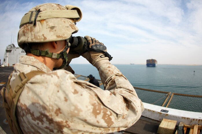 USS NEW YORK (Nov. 5, 2012) — A Marine with Battalion Landing Team 1st Battalion, 2nd Marine Regiment, 24th Marine Expeditionary Unit, stands security watch aboard USS New York as the ship transits through the Suez Canal Nov. 5, 2012. The 24th MEU is deployed with the Iwo Jima Amphibious Ready Group and is currently in the 6th Fleet Area of Responsibility as a disaster relief and crisis response force. Since deploying in March, they have supported a variety of missions in the U.S. Central and European Commands, assisted the Navy in safeguarding sea lanes, and conducted various bilateral and unilateral training events in several countries in the Middle East and Africa. The 24th MEU is scheduled to return to their home bases in North Carolina later this year. (U.S. Marine Corps photo by Cpl. Michael Petersheim/Released)
