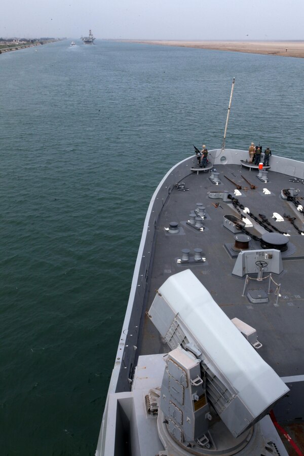 USS NEW YORK (Nov. 5, 2012) — Marines and Sailors with the 24th Marine Expeditionary Unit and the Iwo Jima Amphibious Ready Group stand watch on the bow of the USS New York as it follows the USS Iwo Jima through the Suez Canal, Nov. 5, 2012. The 24th MEU is deployed with the Iwo Jima Amphibious Ready Group and is currently in the 6th Fleet Area of Responsibility as a disaster relief and crisis response force. Since deploying in March, they have supported a variety of missions in the U.S. Central and European Commands, assisted the Navy in safeguarding sea lanes, and conducted various bilateral and unilateral training events in several countries in the Middle East and Africa. The 24th MEU is scheduled to return to their home bases in North Carolina later this year. (U.S. Marine Corps photo by Staff Sgt. Robert Fisher III/Released)