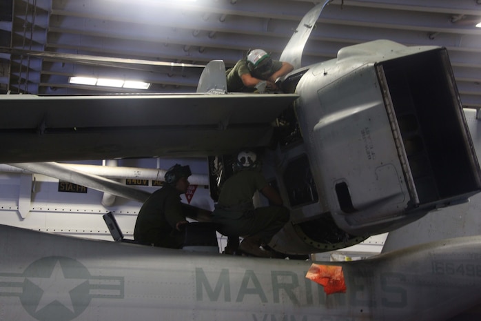 USS IWO JIMA (Nov. 7, 2012) - Marines with Marine Medium Tiltrotor Squadron 261 (Reinforced), 24th Marine Expeditionary Unit, conduct maintenance on an MV-22B Osprey aboard the USS Iwo Jima, Nov. 7, 2012. The 24th MEU is deployed with the Iwo Jima Amphibious Ready Group and is currently in the 6th Fleet Area of Responsibility as a disaster relief and crisis response force. Since deploying in March, they have supported a variety of missions in the U.S. Central and European Commands, assisted the Navy in safeguarding sea lanes, and conducted various bilateral and unilateral training events in several countries in the Middle East and Africa. The 24th MEU is scheduled to return to their home bases in North Carolina later this year. (U.S. Marine Corps photo by Lance Cpl. Tucker S. Wolf/Released)