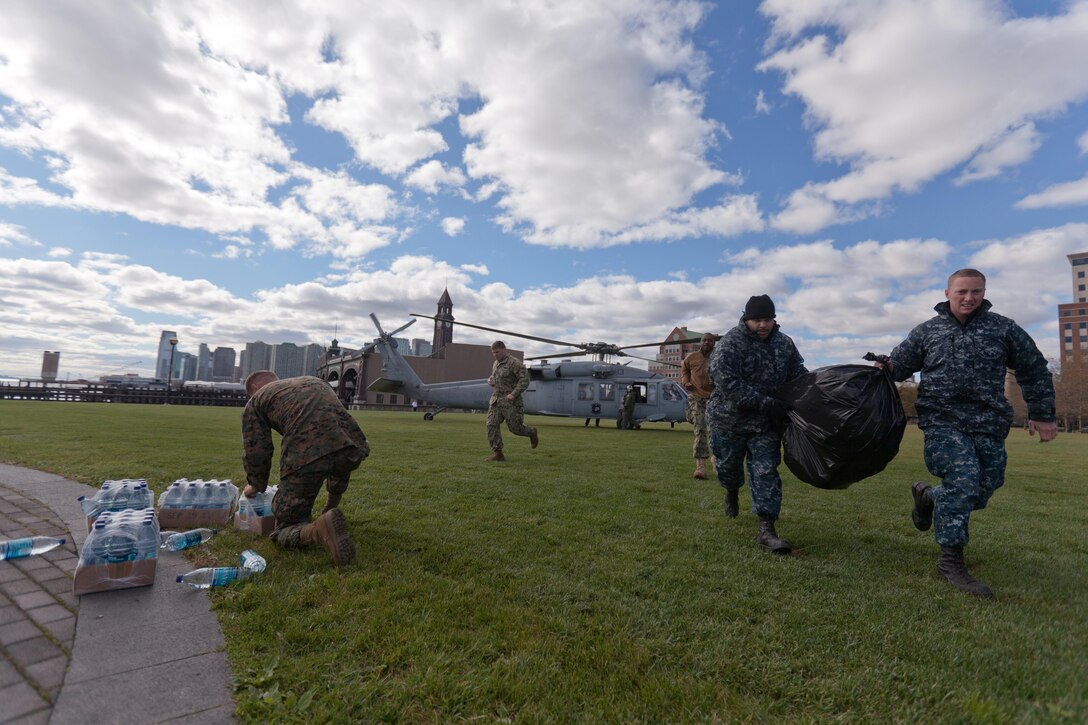 Marines and sailors pull water and supplies off a helicopter in Hoboken, N.J., Nov. 3. The Navy-Marine Corps team is well-equipped to respond to national disasters when required, through the coordination of U.S. Northern Command.  While the military plays an important role in disaster response, all our efforts are in support of FEMA first and foremost, who coordinate closely with state and local officials.