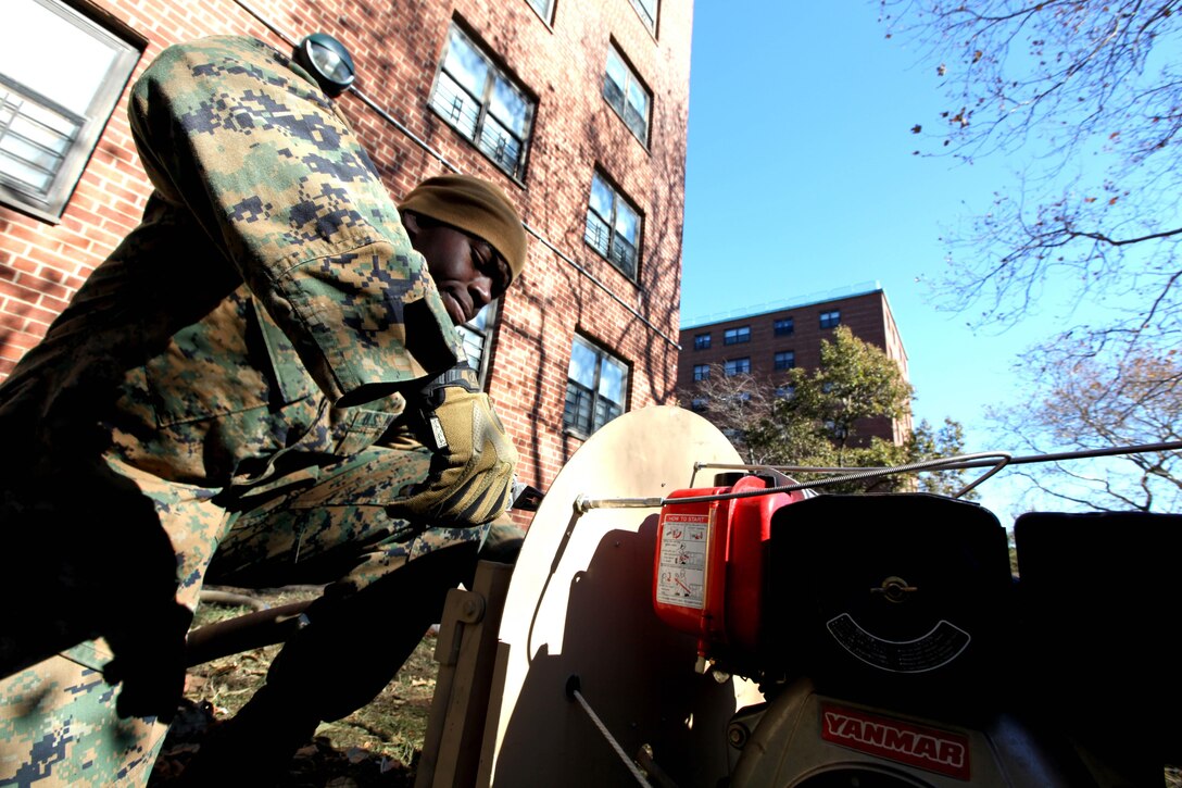 Cpl. Smith Thenor, a Marine with 8th Engineer Battalion, 2nd Marine Logistics Group, starts the engine to a water pump in order to remove water from a flooded building while conducting humanitarian operations in Far Rockaway, N.Y., Nov. 4. In coordination with United States Northern Command approximately 86 Marines from the unit were deployed to New York to help pump water from flooded areas of the state.
