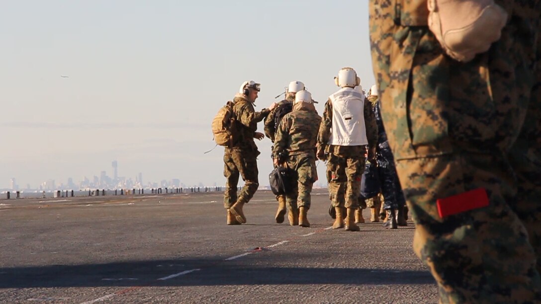General James F. Amos, Commandant of the Marine Corps, and Sergeant Major Michael P. Barrett, Sergeant Major of the Marine Corps, visits Marines and sailors assigned to the 26th Marine Expeditionary Unit  aboard the USS Wasp (LHD-1), Nov. 5, 2012, to discuss the MEU’s support of Hurricane Sandy disaster relief efforts in New York and New Jersey. The 26th MEU is capable of providing generators, fuel, clean water, and helicopter lift capabilities to aid in disaster relief efforts. The 26th MEU is currently in pre-deployment training, preparing for their departure in 2013. As an expeditionary crisis response force operating from the sea the MEU is a Marine Air-Ground Task Force capable of conducting amphibious operations, crisis response, and limited contingency operations. (U.S. Marine Corps photo by Lance Cpl Juanenrique Owings/Released)  