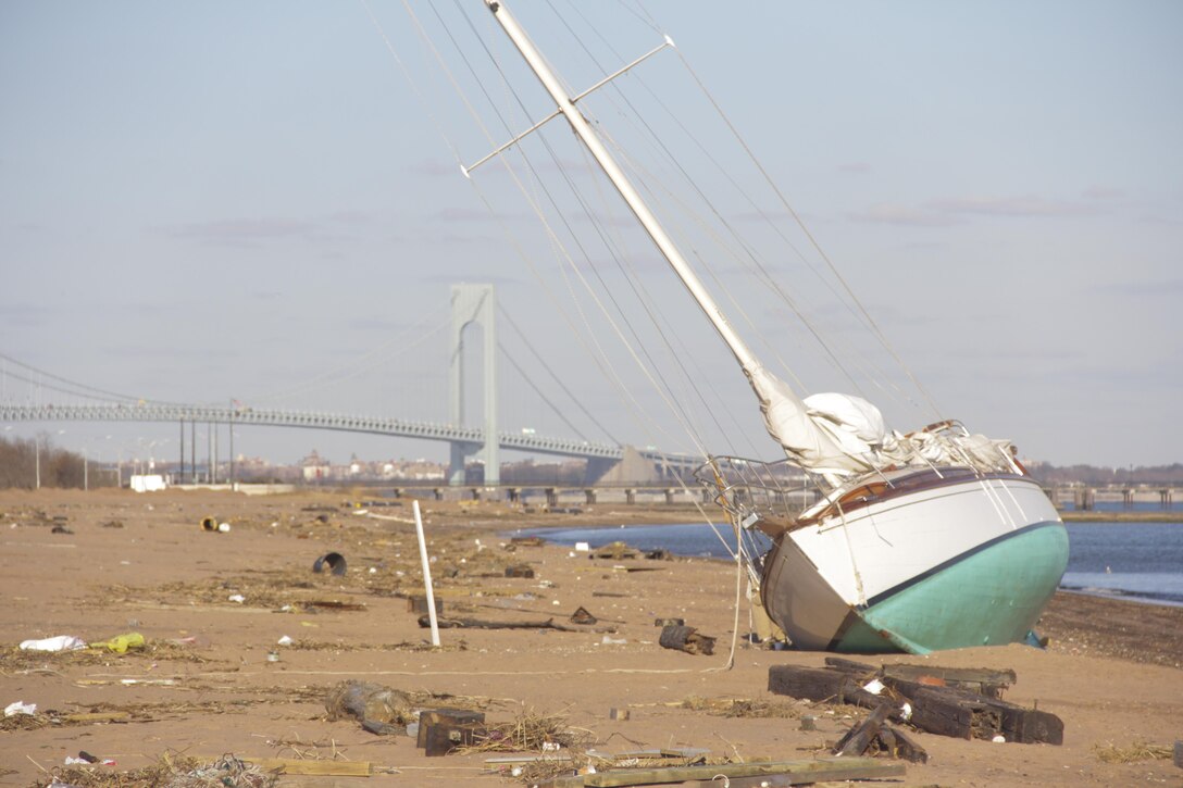 Tremendous piles of debris that have accumulated on Staten Island in the wake of Hurricane Sandy, Nov. 5, 2012. The 26th MEU is able to provide generators, fuel, clean water, and helicopter lift capabilities to aid in disaster relief efforts. The 26th MEU was currently conducting pre-deployment training, preparing for their departure in 2013. As an expeditionary force operating from the sea, the MEU is a Marine Air-Ground Task Force capable of conducting amphibious operations, crisis response, and limited contingency operations. (Official U.S. Marine Corps photo by Cpl. Michael S. Lockett/Released)