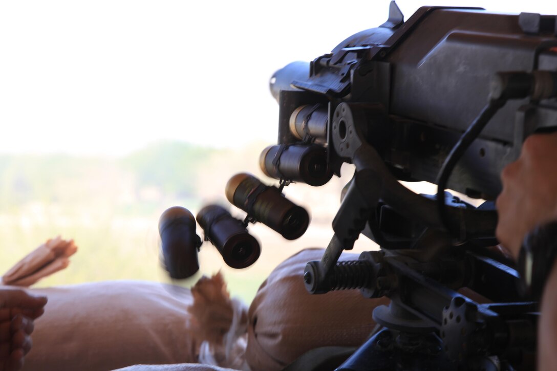 A Marine with U.S. Marine Corps Forces, Special Operations Command fires an MK-47 automatic grenade launcher at insurgents in Nahr-e Saraj district, Helmand Province April 3. Marines with MARSOC's 1st Marine Special Operations Battalion recently returned from a nine-month deployment to Afghanistan, where they commanded the Special Operations Task Force - West and oversaw one of Afghanistan's bloodiest regions. (U.S. Marine Corps photo by Cpl. Kyle McNally/Released)