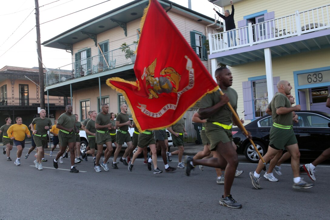 The Marines and sailors of 4th Marine Logistics Group fly their colors high for onlookers during a motivational run in New Orleans Nov. 7, 2012.  Marine Corps Siupport Facility is the headquarters for Marine Forces Reserve, the largest command in the Marine Corps, housing 4th Marine Division, 4th Marine Aircraft Wing, 4th Marine Logistics Group and Force Headquarters Group. This event marked the first time the Marines have done a commander-led motivational run at the MARCORSPTFAC since the Marines officially moved there June 27, 2011. The run was also to commemorate the Marines’ 237th birthday. (U.S. Marine Corps photo by Sgt. Ray Lewis/Released)