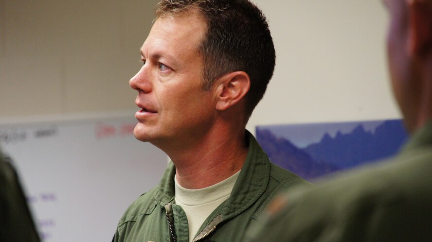 Lt. Col. James Sage holds a briefing before the pilots roll out for the first training sortie of the day for these F-22 pilots at Joint Base Pearl Harbor-Hickam.