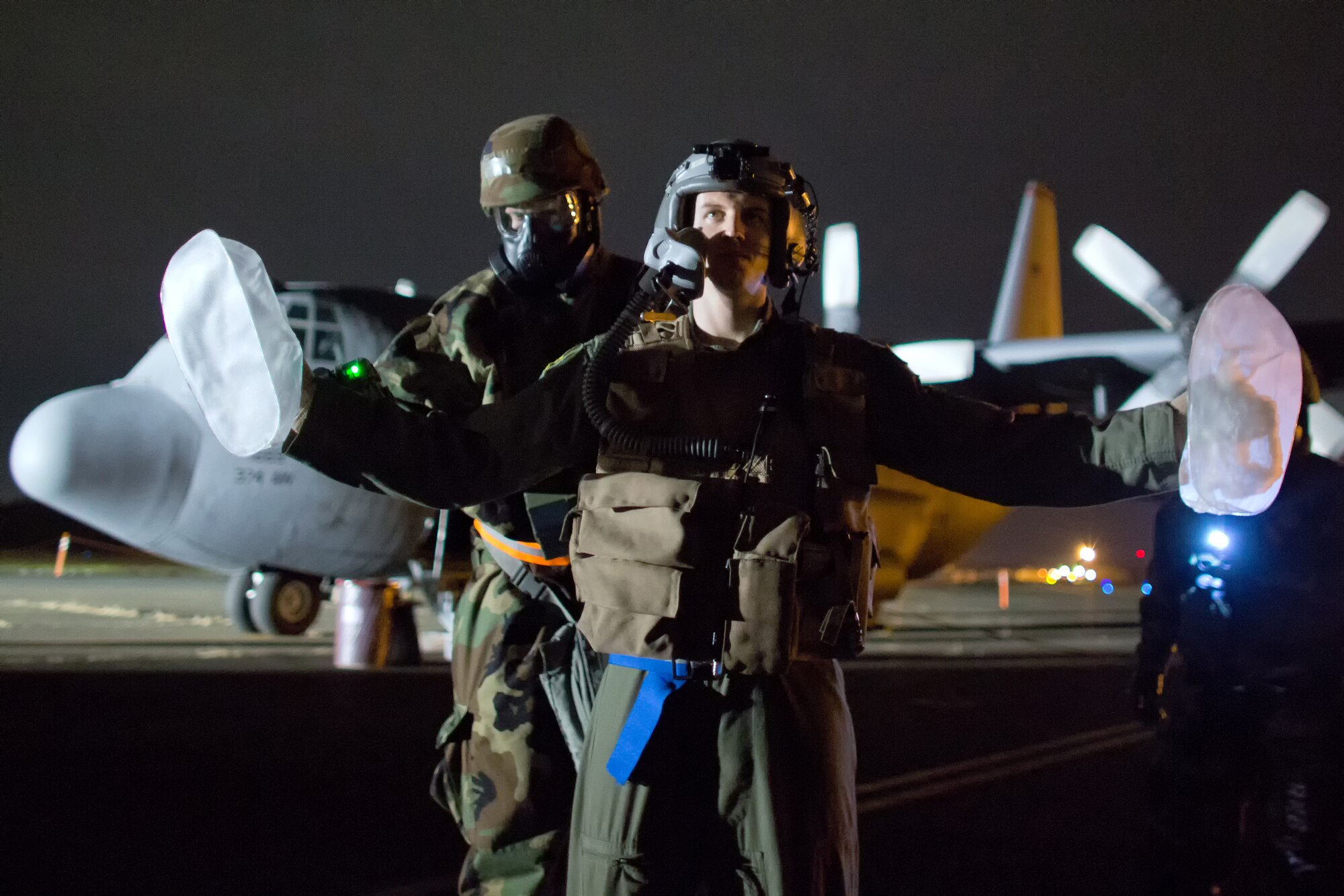 YOKOTA AIR BASE, Japan -- Airman 1st Class Trevor Greentree, back, 374th Civil Engineer Squadron, scans for simulated chemical agents on a C-130 Hercules aircrew member during an operation readiness exercise at Yokota Air Base, Japan, Nov. 8, 2012. Yokota airmen use exercises to maintain operational readiness capabilities. (U.S. Air Force photo by Osakabe Yasuo)