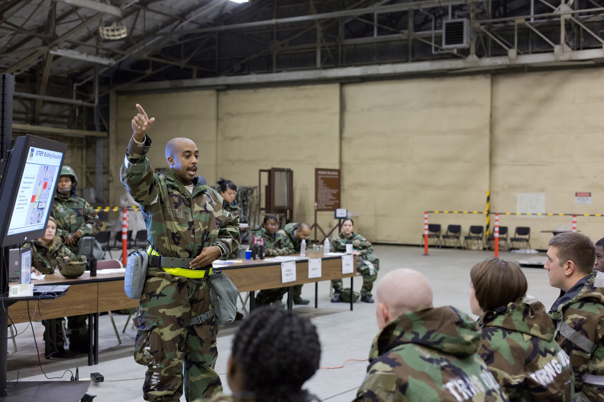 YOKOTA AIR BASE, Japan -- Staff Sgt. Oundra Scott Jr., 374th Force Support Squadron, gives a brief to simulated arriving personnel during operation readiness exercise at Yokota Air Base, Japan, Nov. 8, 2012. The 374th Airlift Wing exercises and inspections office organizes regularly scheduled exercises to test the capabilities of base personnel to respond to a variety of possible accidents and incidents. (U.S. Air Force photo by Osakabe Yasuo) 