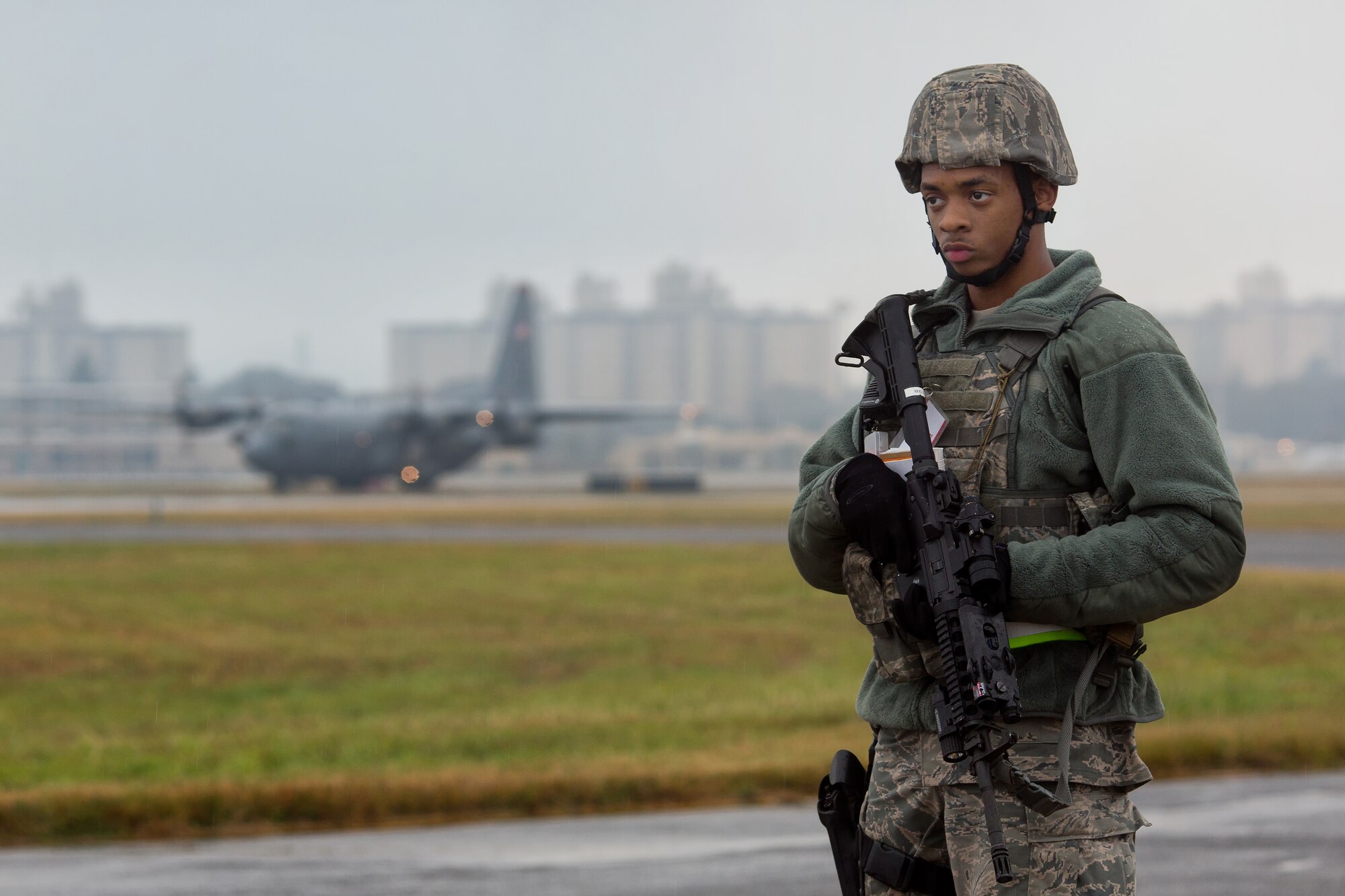 YOKOTA AIR BASE, Japan -- Airman 1st Class Andre Wilson, 374th Security Forces Squadron patrolman, guards the flightline during an exercise scenario at Yokota Air Base, Japan, Nov. 6, 2012. Yokota Airmen participated in the exercise to maintain their operational readiness capabilities. (U.S. Air Force photo by Osakabe Yasuo)