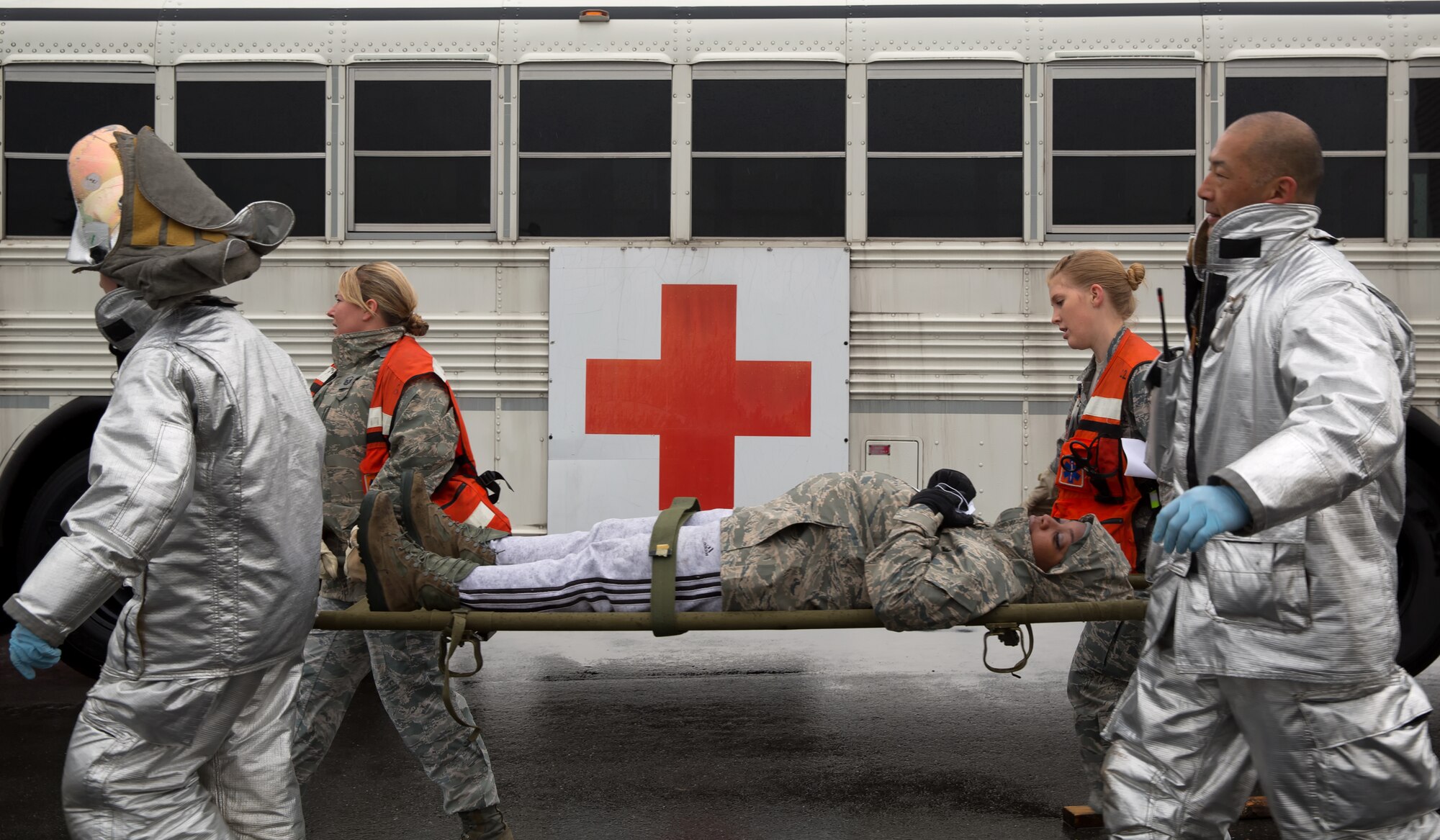 YOKOTA AIR BASE, Japan -- First responders from the Yokota Fire Department and 374th Medical Group, transport a simulated patient to a medical transportation bus during an operational readiness exercise at Yokota Air Base, Japan, Nov. 6, 2012. Yokota Airmen participated in the exercise to maintain their operational readiness capabilities. (U.S. Air Force photo by Osakabe Yasuo)
