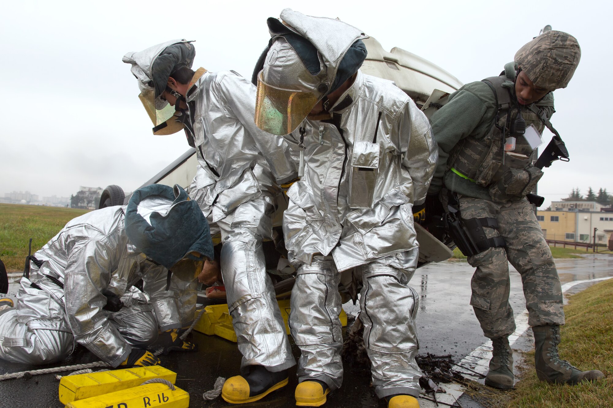 YOKOTA AIR BASE, Japan -- Members from the Yokota Firefighter and 374th Security Forces perform a vehicle extraction during an operational readiness exercise at Yokota Air Base, Japan, Nov. 6, 2012. Vehicle extraction is the process of removing a person from a vehicle that has been involved in an accident when conventional means of exit are impossible. (U.S. Air Force photo by Osakabe Yasuo)