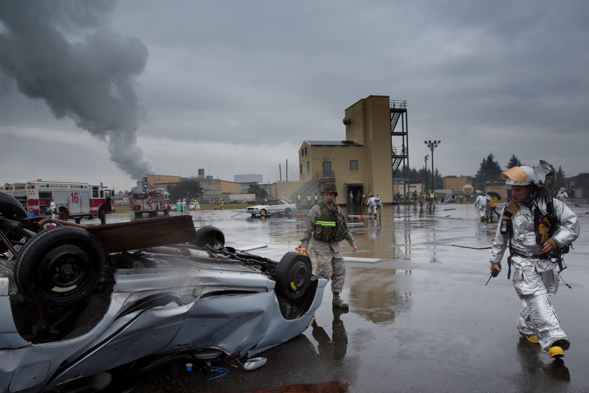 YOKOTA AIR BASE, Japan -- First responders from the 374th Security Forces and Yokota Fire Department arrive at a simulated disaster area during an operational readiness exercise at Yokota Air Base, Japan, Nov. 6, 2012. Yokota Airmen participated in the exercise to maintain their operational readiness capabilities. (U.S. Air Force photo by Osakabe Yasuo) 