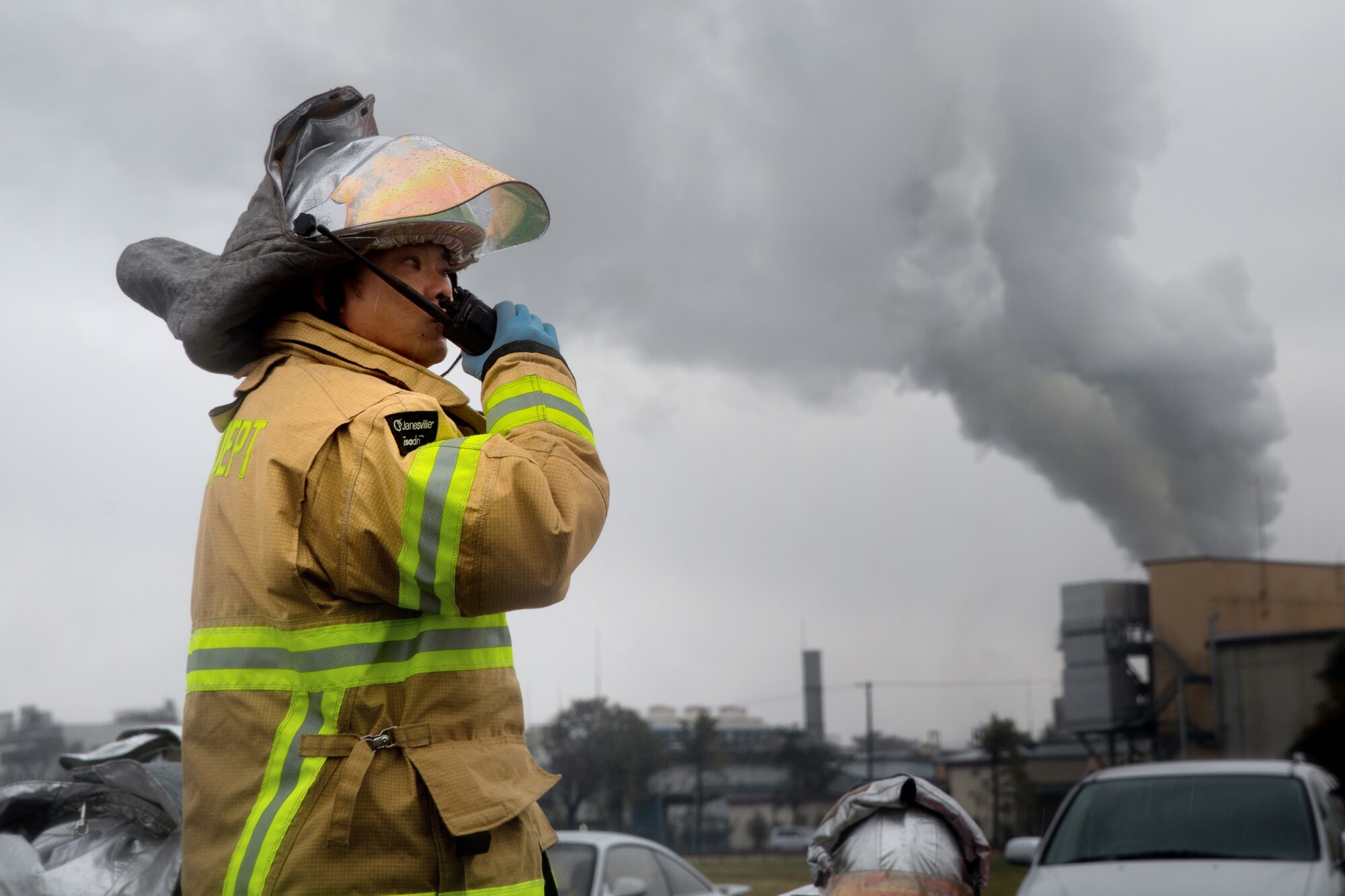 YOKOTA AIR BASE, Japan -- Kazuhisa Iizuka, Yokota Fire Department fire crewchief, gives a report to the fire dispatch center during an operational readiness exercise at Yokota Air Base, Japan, Nov. 6, 2012. The 374th Airlift Wing exercises and inspections office organizes regularly scheduled exercises to test the capability of base personnel to respond to a variety of possible accidents and incidents. (U.S. Air Force photo by Osakabe Yasuo)