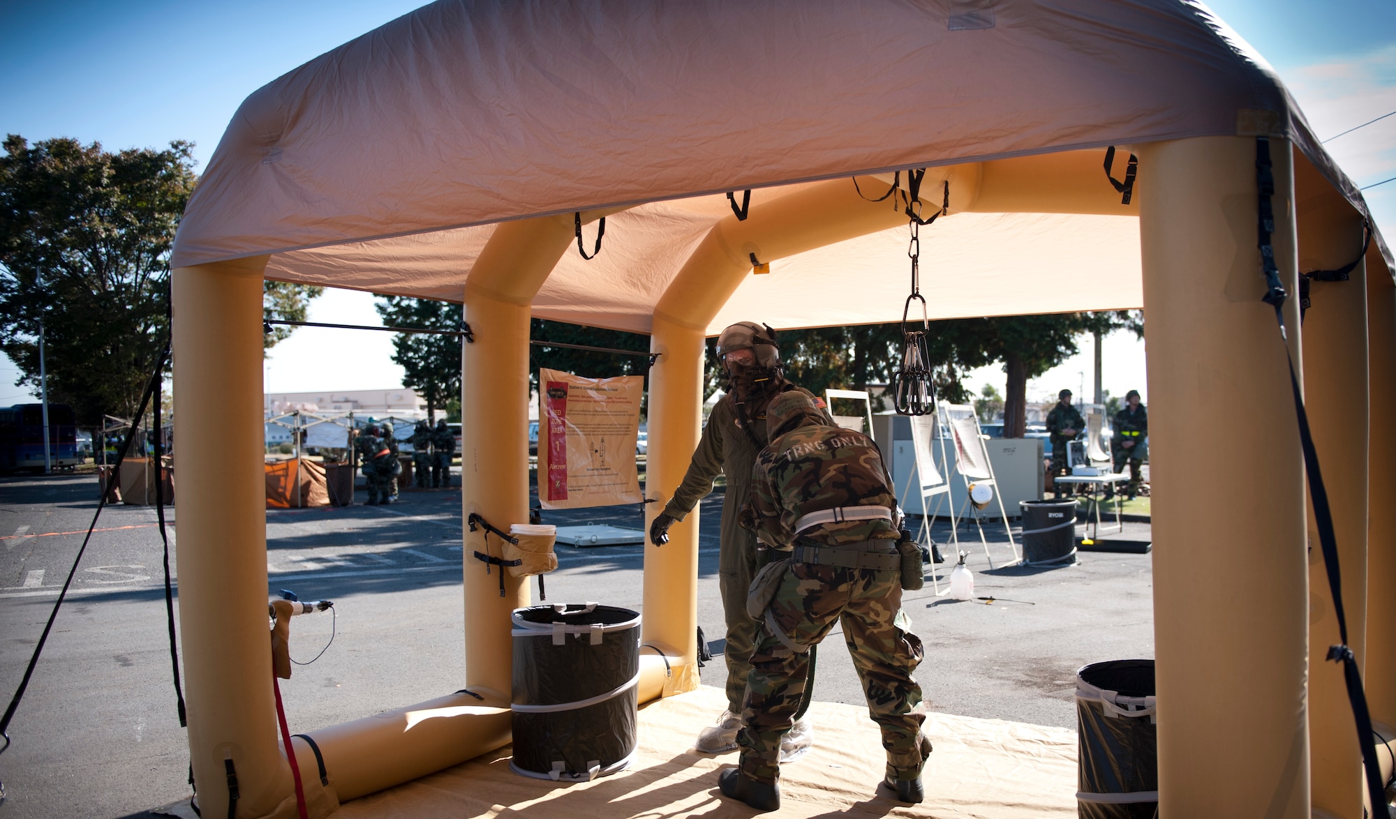 YOKOTA AIR BASE, Japan -- An air crew member is decontaminated at a simulated decontamination site during an operational readiness exercise Nov. 8, 2012, at Yokota Air Base, Japan. Decontamination is a multi-step process. (U.S. Air Force photo by Airman 1st Class Krystal M. Garrett)  