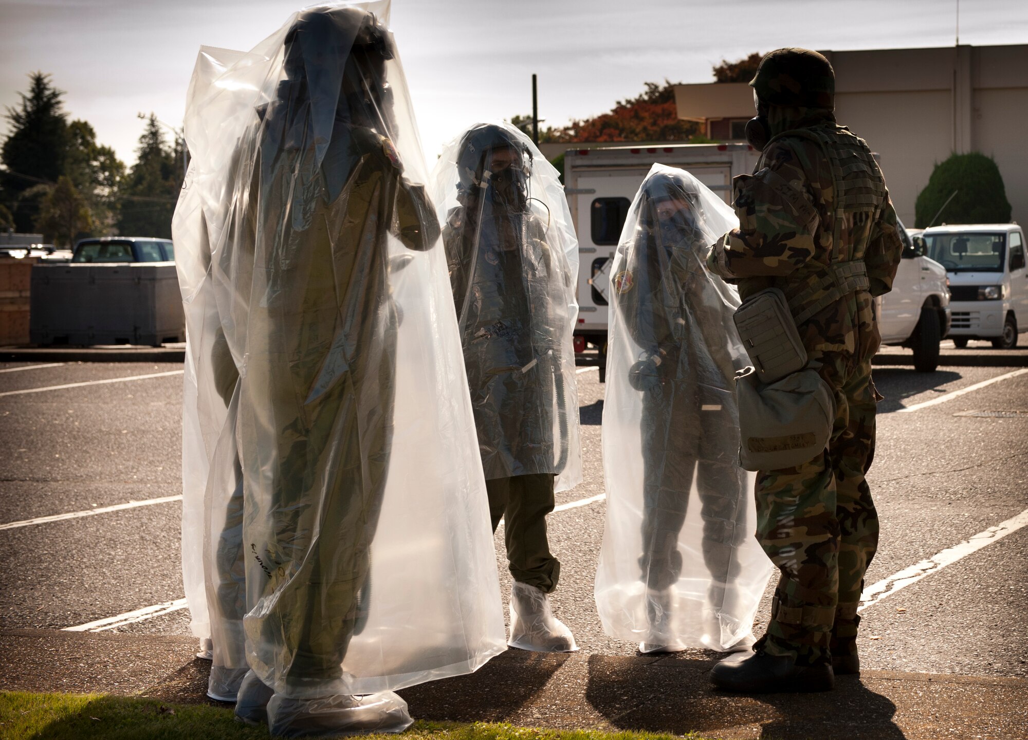 YOKOTA AIR BASE, Japan -- Air crew members are briefed before they process through a simulated decontamination line Nov. 8, 2012, during an operational readiness exercise at Yokota Air Base, Japan. Decontamination lines are used when Airmen have come in contact with chemical agents. (U.S. Air Force photo by Airman 1st Class Krystal M. Garrett) 