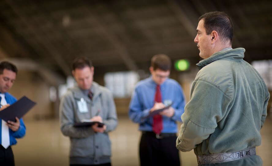 YOKOTA AIR BASE, Japan -- Col. Mark August, 374th Airlift Wing commander, talks with media during a simulated press conference at Yokota Air Base, Japan on Nov. 6, 2012, during an operational readiness exercise. Press conferences are often held to inform the public of the current situation and answer questions the media has. (U.S. Air Force photo by Airman 1st Class Krystal M. Garrett)
