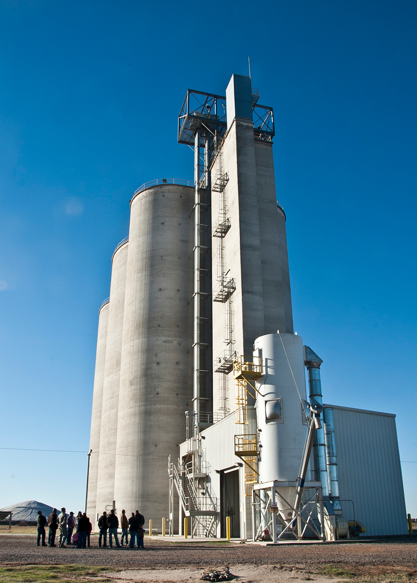 ALTUS, Okla., -- Altus AFB personnel and families tour the Galivon grain elevator during Farm City week, Nov. 7, 2012. The grain elevator is used to quickly dispense grains and fertilizers into train carts for export to countries around the world. Farm City Week is held annually to highlight the importance of agriculture in the Altus and Jackson County economy and focuses on the partnership between the base and the local farming industry. (U.S. Air Force photo by Airman 1st Class Levin Boland / Released)