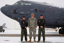 MINOT AIR FORCE BASE, N.D. -- Maj. David Golden and 1st Lt. Fleming Thompson, 23 Bomb Squadron, 5th Operations Group, and U.S. Army Capt. Joshua Payne, 5th Operations Support Squadron, have epitomized the 5th Bomb Wing commander's vision of mission ownership. These three officers orchestrated and executed the training for the 23d Bomb Squadron's tri-service multi-national JTAC CAS training exercise Operation COLD SNAP. Intrepid planning and execution resulted in 22 B-52H Stratofortress sorties and 8 WSTs directly supporting the Advanced Targeting Pod spin up for the wing. Utilizing ground assets, Golden, Payne, and Thompson created a realistic ground scenario requiring aircrew to locate and destroy enemy targets, track moving vehicles, and monitor enemy ground troop movements. This training resulted in an increase of the 5th BW's ATP crew numbers by 400 percent and saved the wing $2.6 million through shorter sorties and reduced sortie requirements. Their determined work produced a far more combat capable crew force for the 5th BW, capable of answering the nations call at a moments notice.