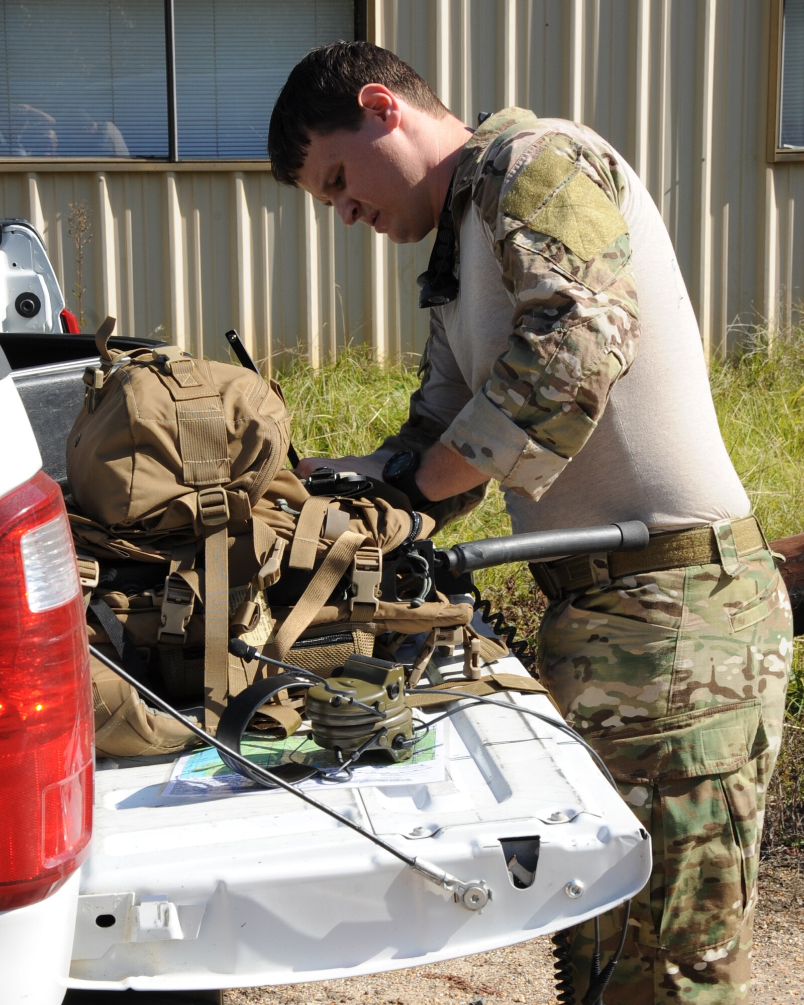 Staff Sgt. Charles Millison, 2nd Operation Support Squadron Survival, Evasion, Resistance and Escape operations NCO in charge, sets up a radio during the SERE Combat Survival Training on Barksdale Air Force Base, La., Nov. 1. Aircrew assigned here were dropped off in a simulated combat environment and expected to use the skills given to survive, evade capture and return safely. (U.S. Air Force photo/Senior Airman Sean Martin)(RELEASED)