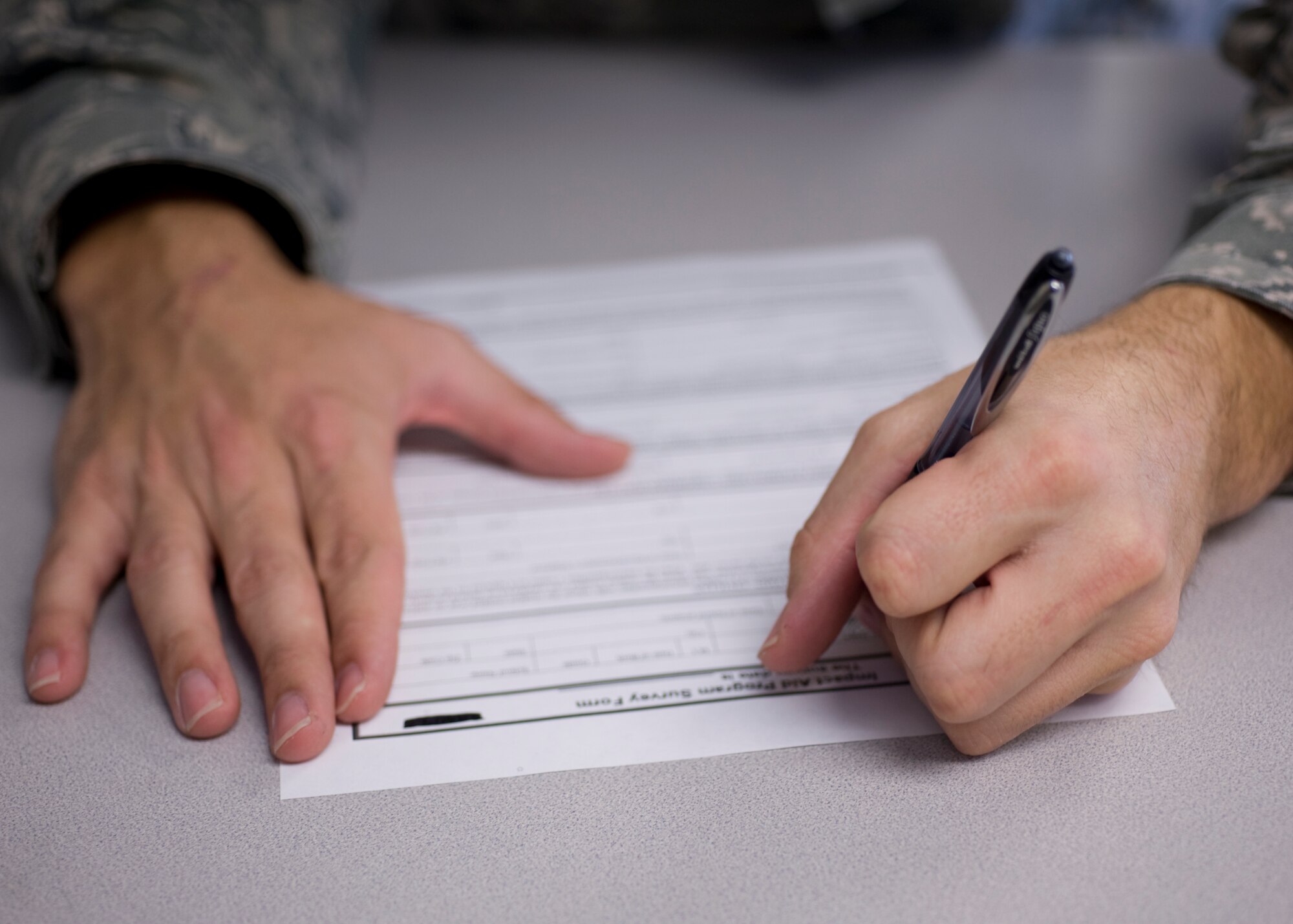 A parent fills out an Impact Aid form on Hurlburt Field, Fla., Nov.7, 2012. Due to tax breaks given to families of military personnel, Impact Aid compensates school systems for missing revenue. (U.S. Air Force photo/ Airman 1st Class Nigel Sandridge)