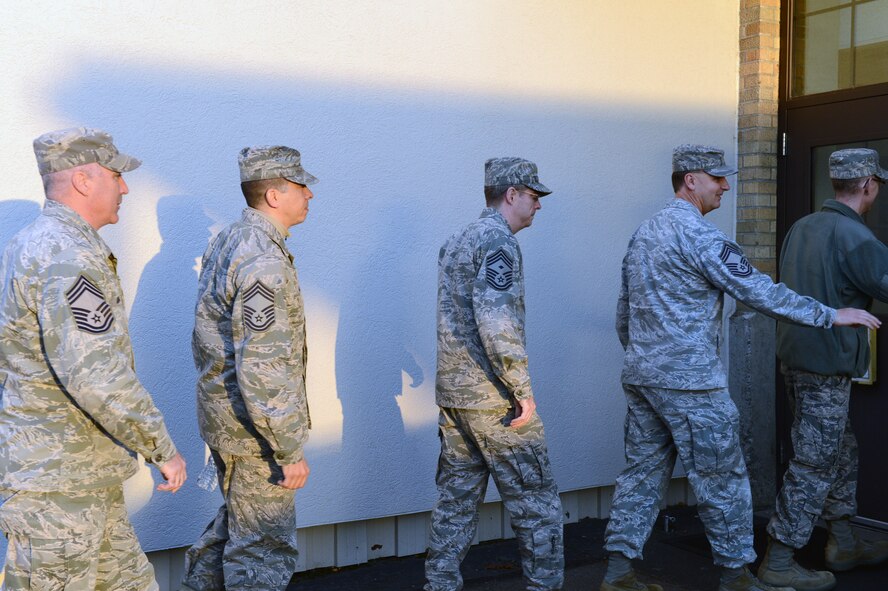 McChord Field chief master sergeants surprise two of the three senior master sergeants selected for promotion to chief master sergeant, Nov. 8, 2012, at Joint Base Lewis-McChord, Wash. The three selected from the 62nd Airlift Wing were Senior Master Sgt. Armando Fajardo, 62nd Comptroller Squadron, Senior Master Sgt. Paul Harvell, 7th Airlift Squadron, and Senior Master Sgt. Richard Tallman, 62nd Maintenance Group. (U.S. Air Force photo/Staff Sgt. Frances Kriss)