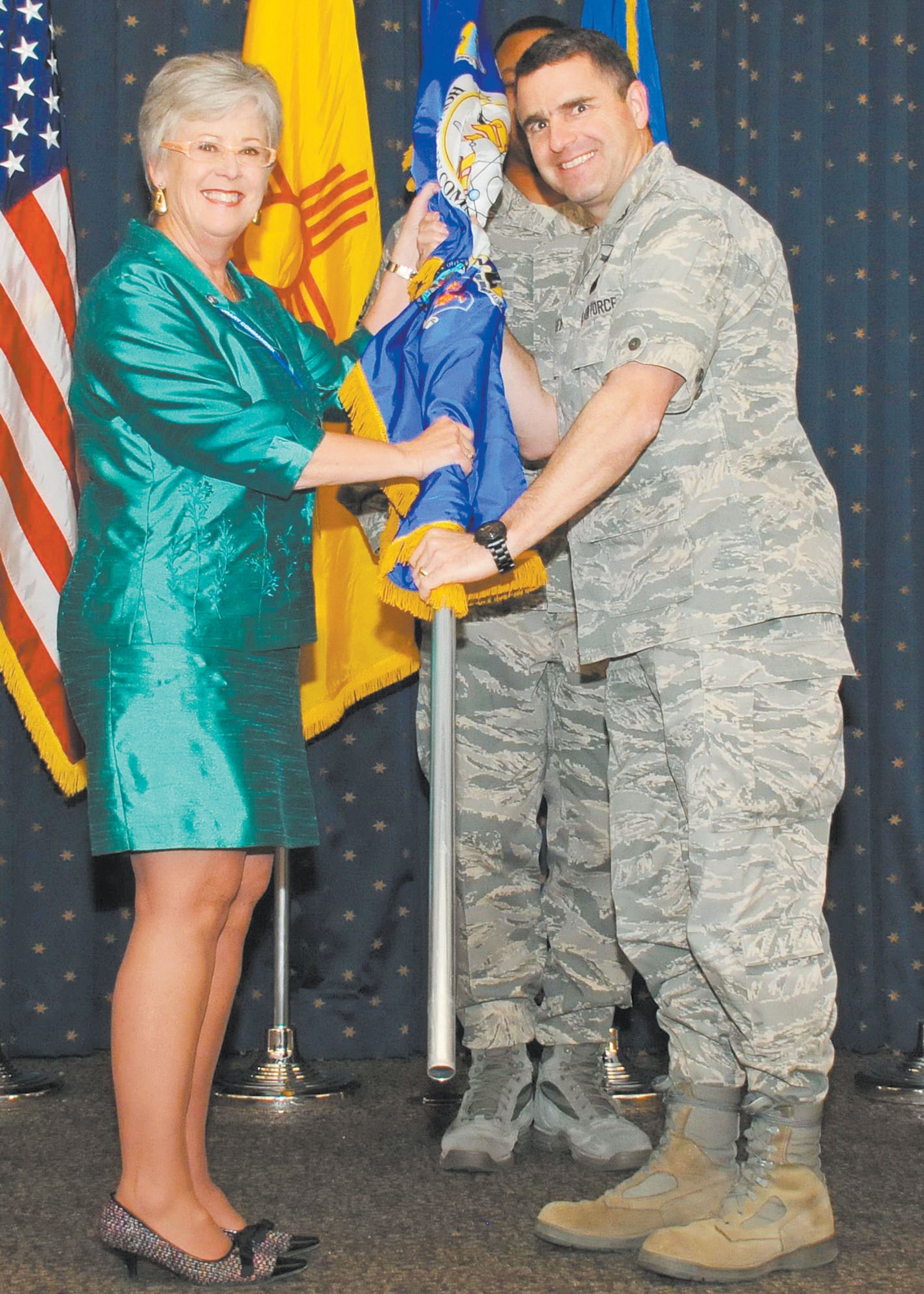 KIRTLAND AFB, N.M. – Team Kirtland held its annual Honorary Commanders Assumption of Command Ceremony Nov. 1 at the Mountain View Club. Col. William Cooley, Air Force Research Laboratory Space Vehicles Directorate director, right, and Barbara Brazil, New Mexico deputy cabinet secretary for business. (Photo by Ken Moore)