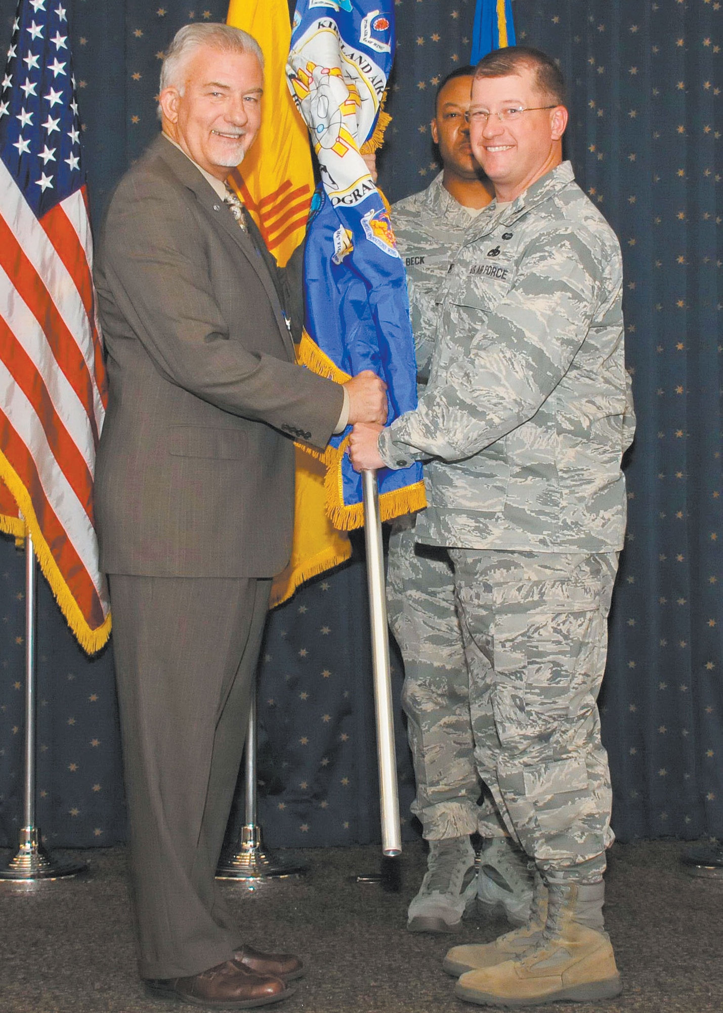 KIRTLAND AFB, N.M. – Team Kirtland held its annual Honorary Commanders Assumption of Command Ceremony Nov. 1 at the Mountain View Club. Col. John Kubinec, 377th Air Base Wing commander, right, and Michael Chase, Chugach Government Services, Inc., quality assurance manager. (Photo by Ken Moore)