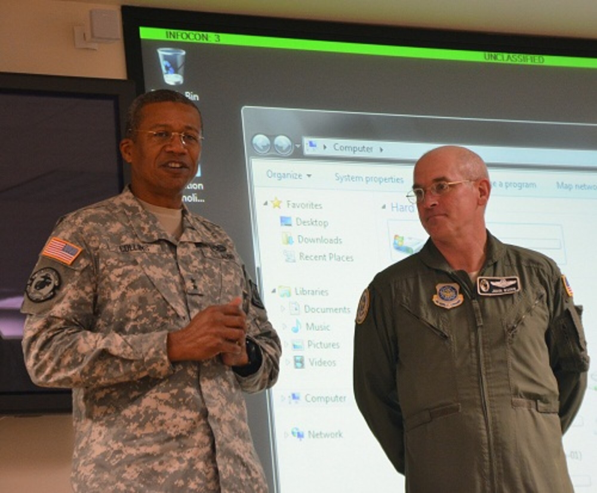 Mississippi Adjutant General Maj. Gen. Augustus L. Collins (left) congratulates members of the 172d Airlift Wing for receiving an 'Excellent' rating for the ORI they completed in October 2012.  Standing with Collins is Air Mobility Command IG team lead, Col. John Quinn who annonced the wing's tremendous achievement on 7 November 2012.