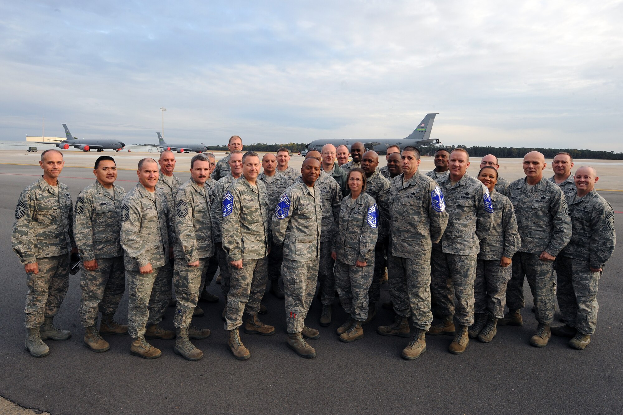 Team Seymour's newest chief master sergeant selects pose for a group photo with Chief Master Sgt. Pete Stone, 4th Fighter Wing command chief, and fellow chiefs on Seymour Johnson Air Force Base, N.C., Nov. 7, 2012. Air Force officials selected 454 of 1,981 eligible senior master sergeants for promotion to chief master sergeant with a selection rate of 22.9 percent. (U.S. Air Force photo/Airman 1st Class John Nieves Camacho/Released)